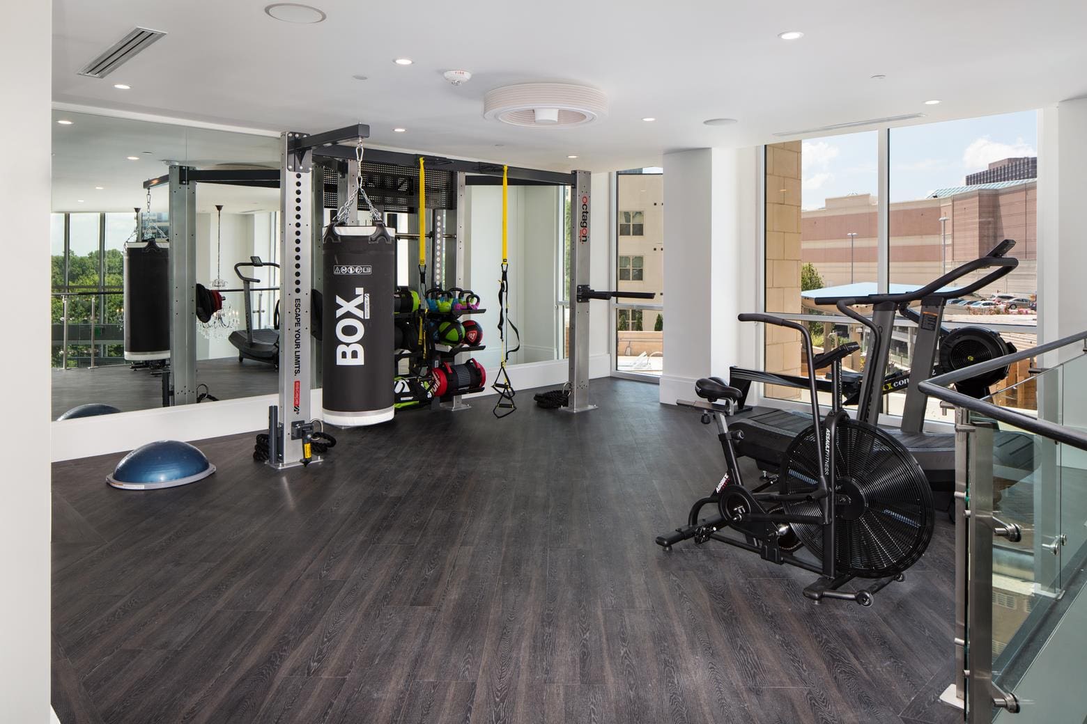 Bright gym with punching bag and exercise bike