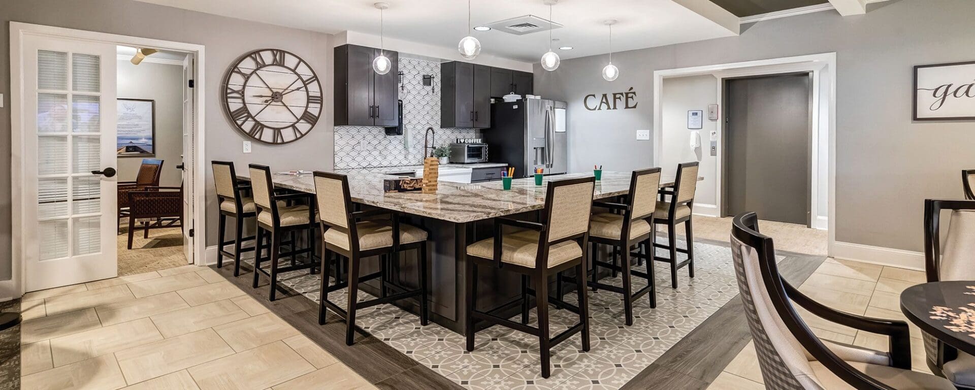 Modern kitchen and dining area with decor.
