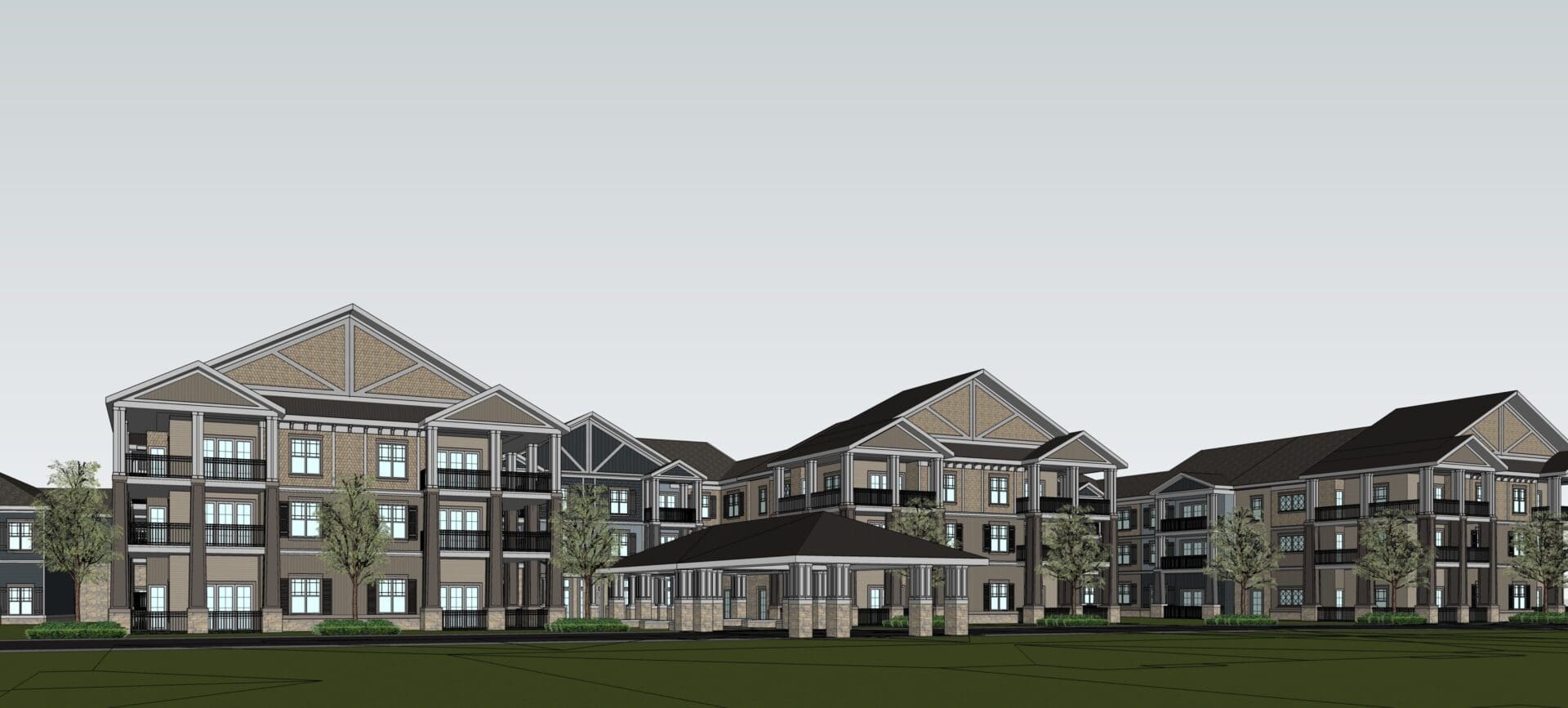 Modern apartment complex with green surroundings.