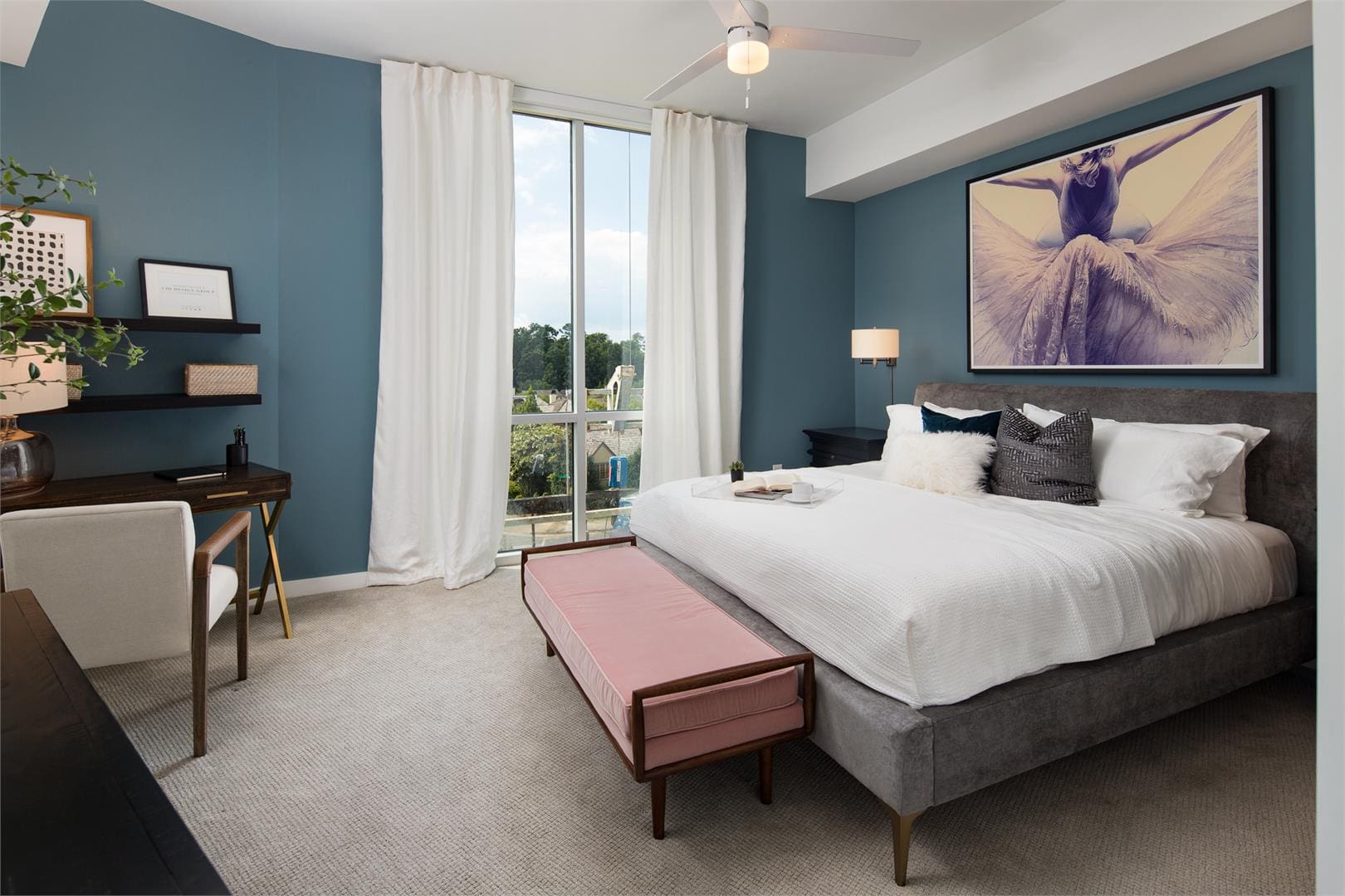 Modern teal bedroom with balcony view