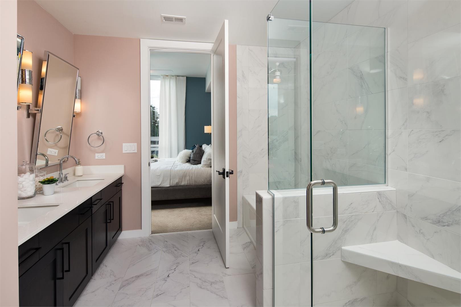 Marble bathroom with glass shower and double vanity