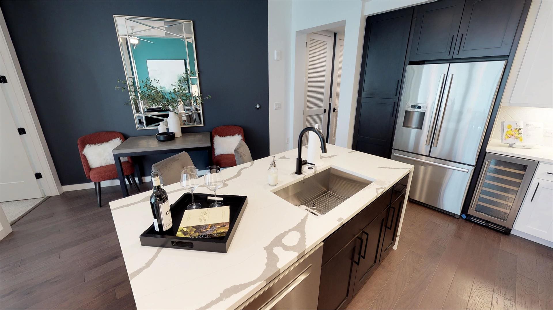 Modern kitchen with island and dining area.