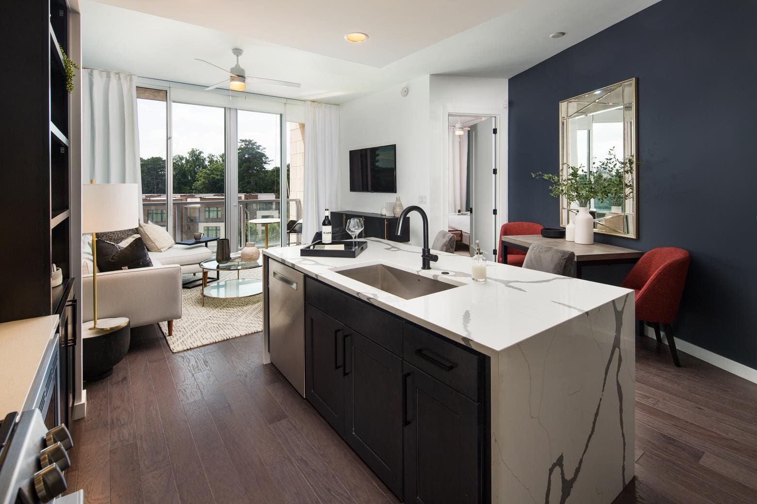 Open-concept kitchen with island and balcony