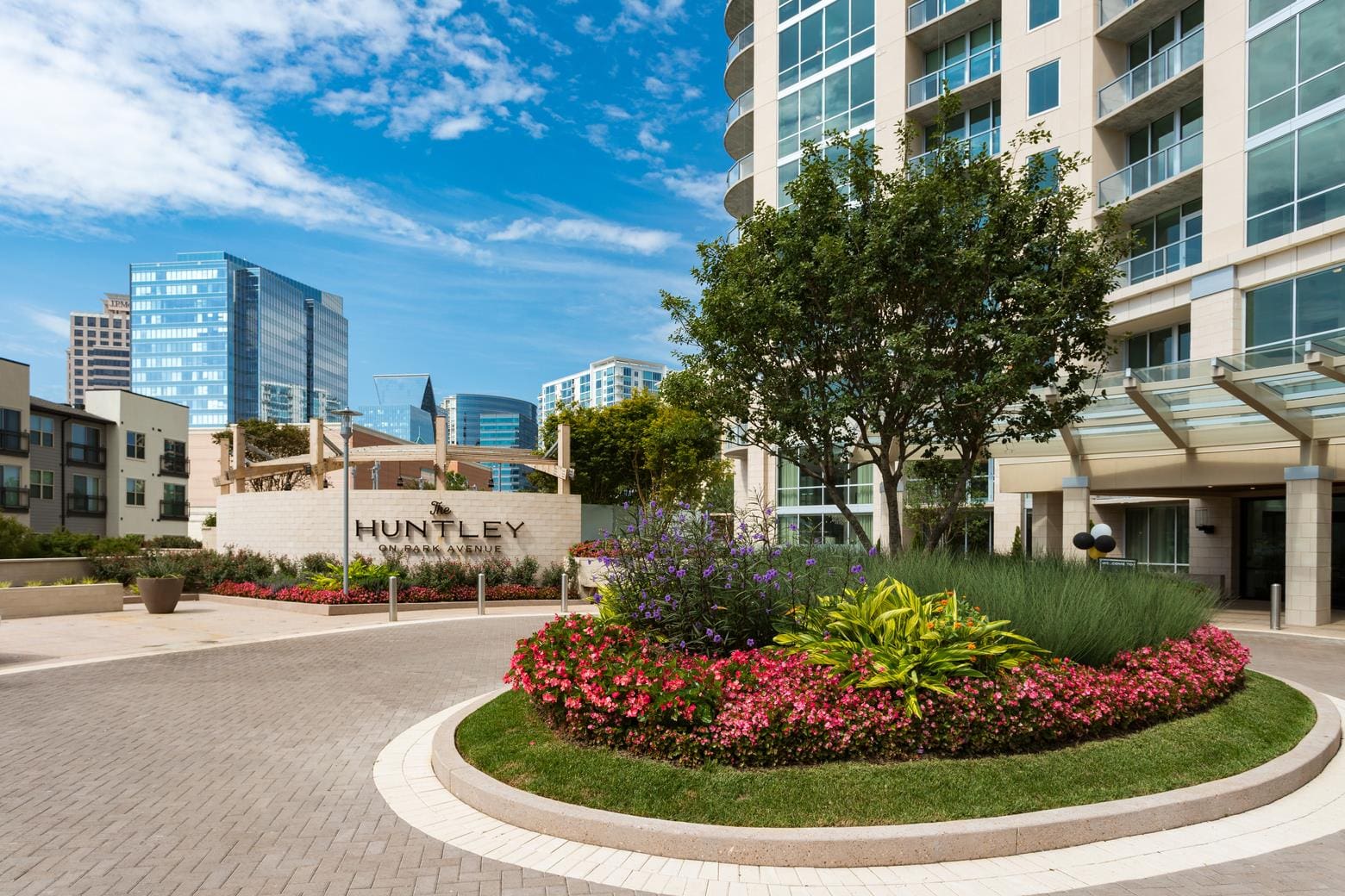 Modern building entrance with landscaped garden.