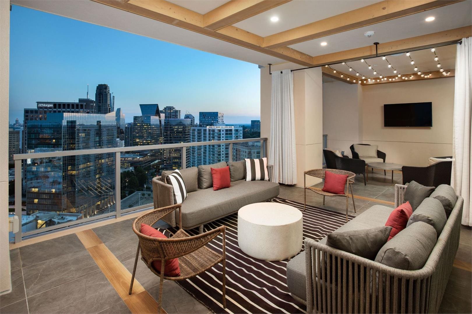 Rooftop lounge with city skyline view.