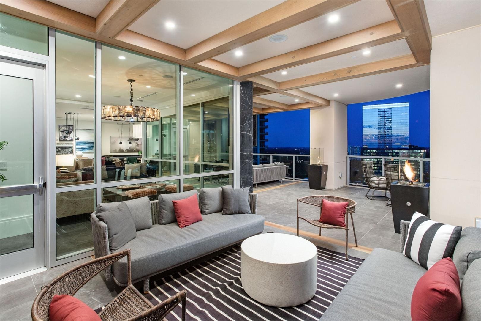 Modern living room with city view balcony.