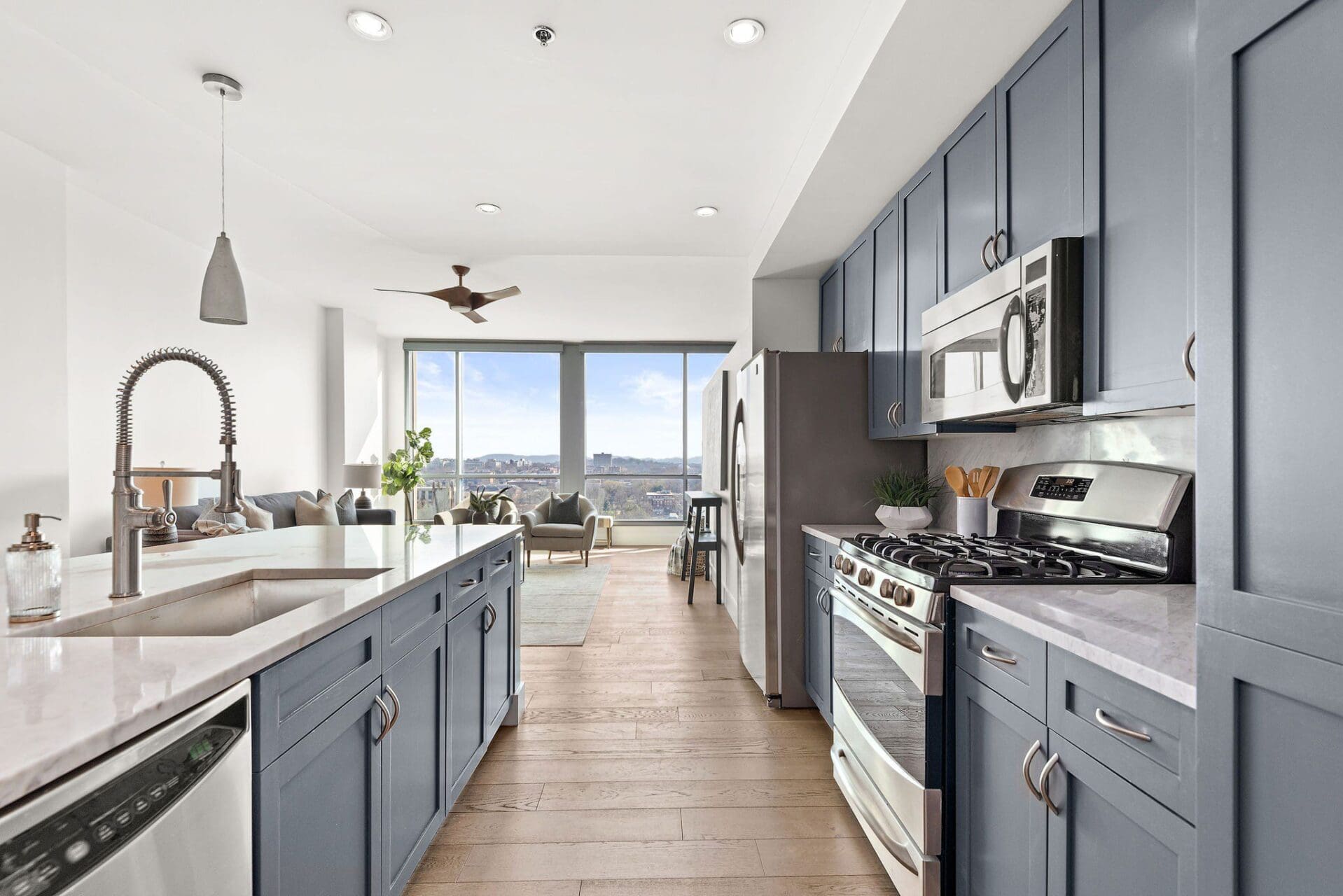 Modern kitchen with blue cabinets and island.