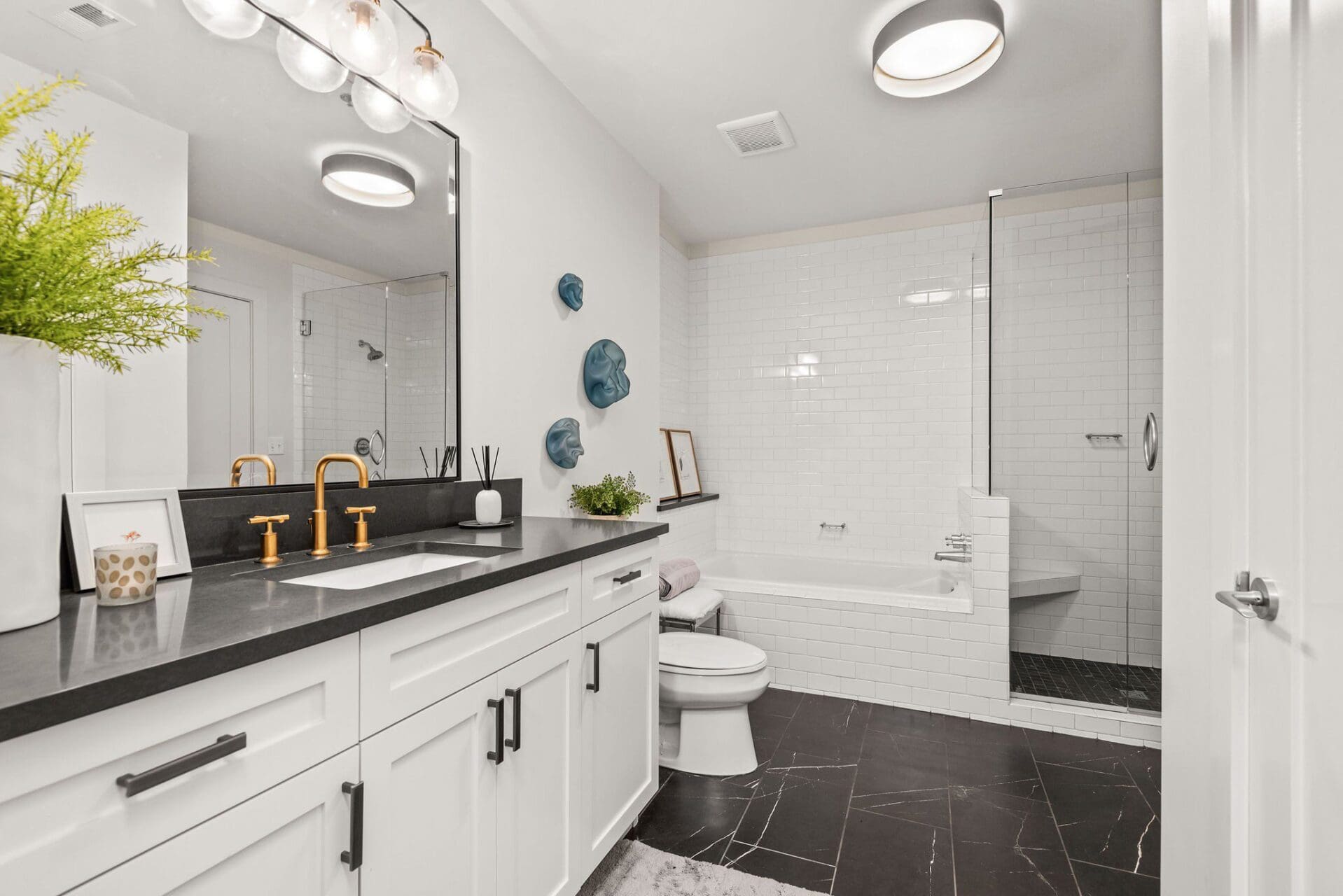 Modern bathroom with black and white decor.