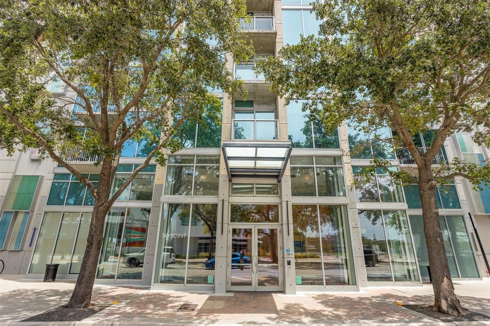 Modern building entrance with glass facade.