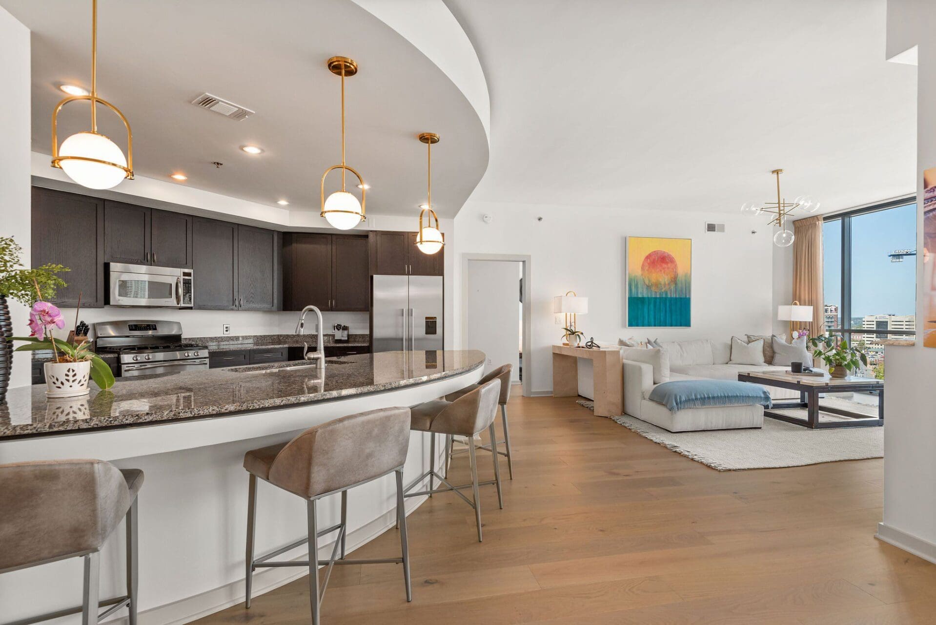 Curved kitchen island in modern living space
