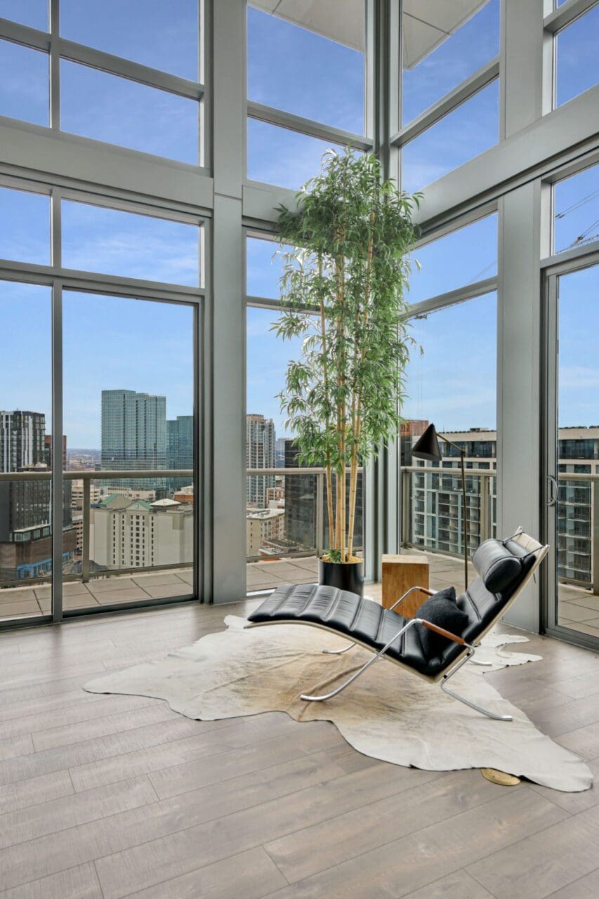 Modern lounge chair in bright city apartment.