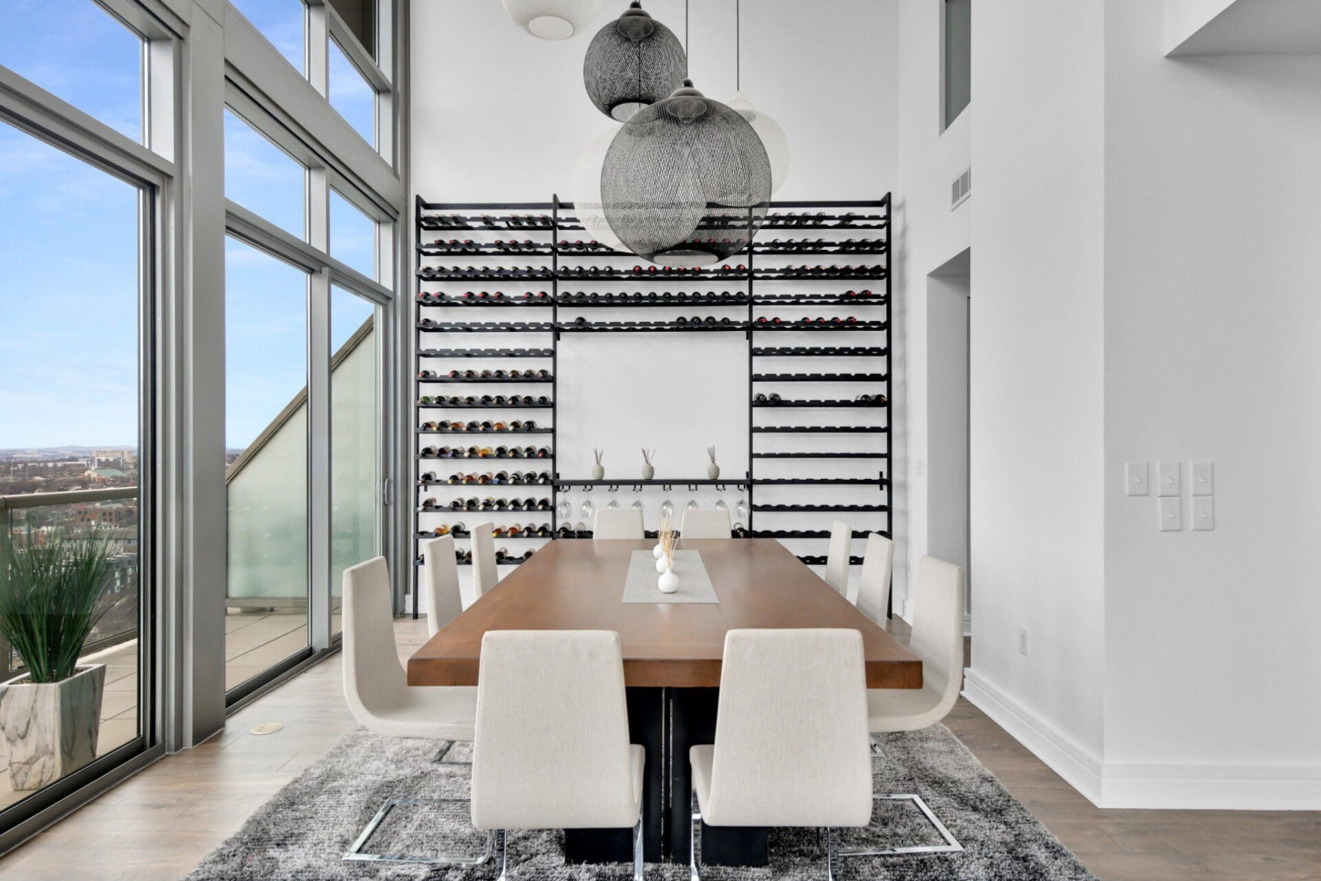 Modern dining room with wine rack display.