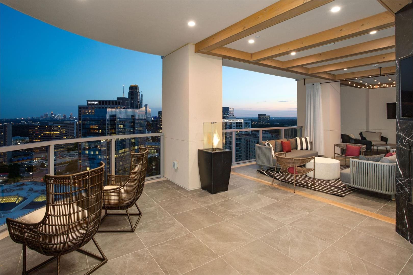 Rooftop patio with city skyline view.