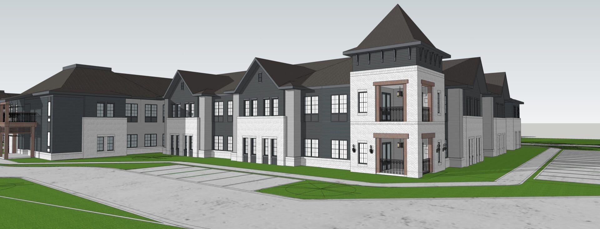Modern multi-story building with peaked roofs.