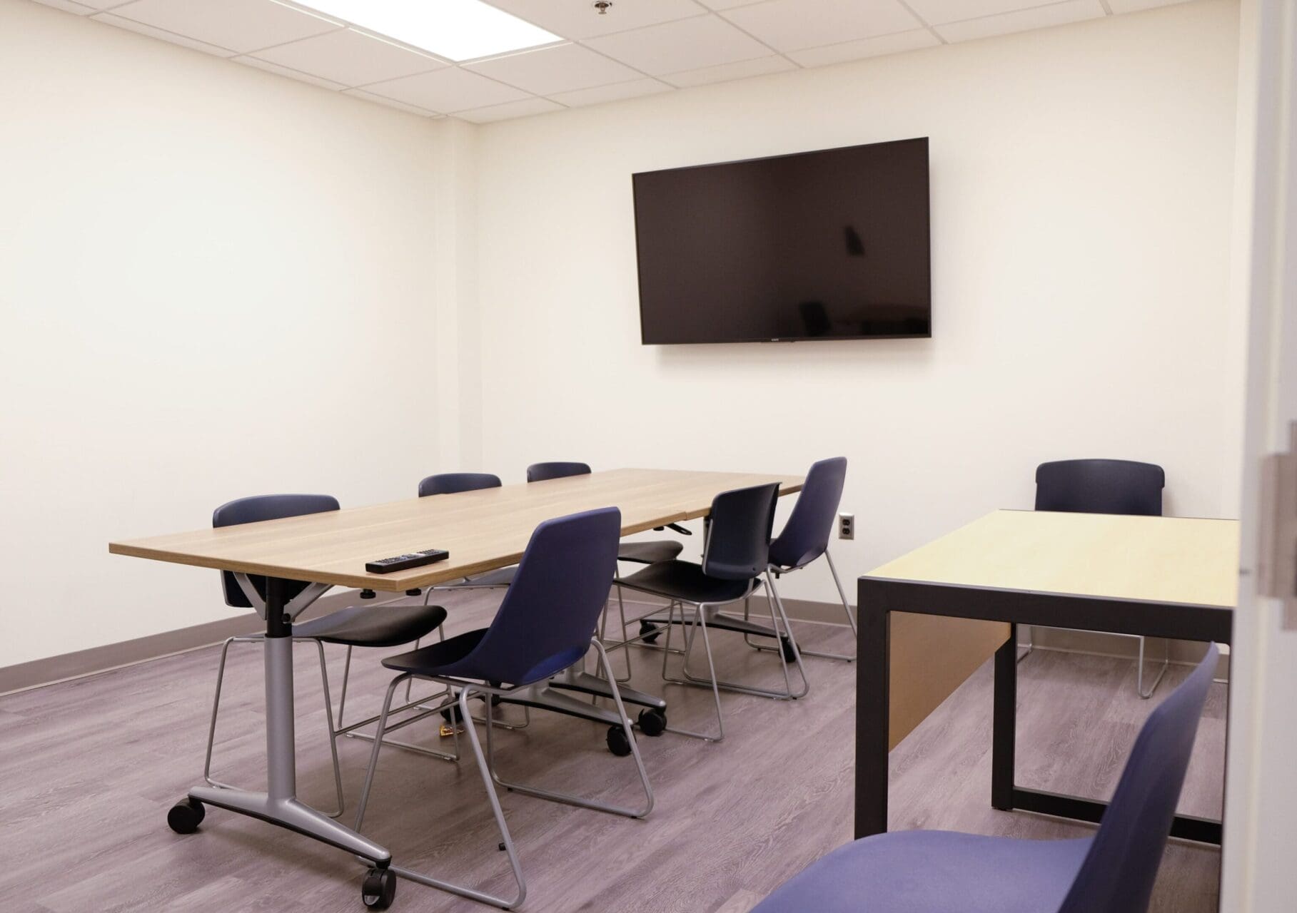 Conference room with table and chairs.