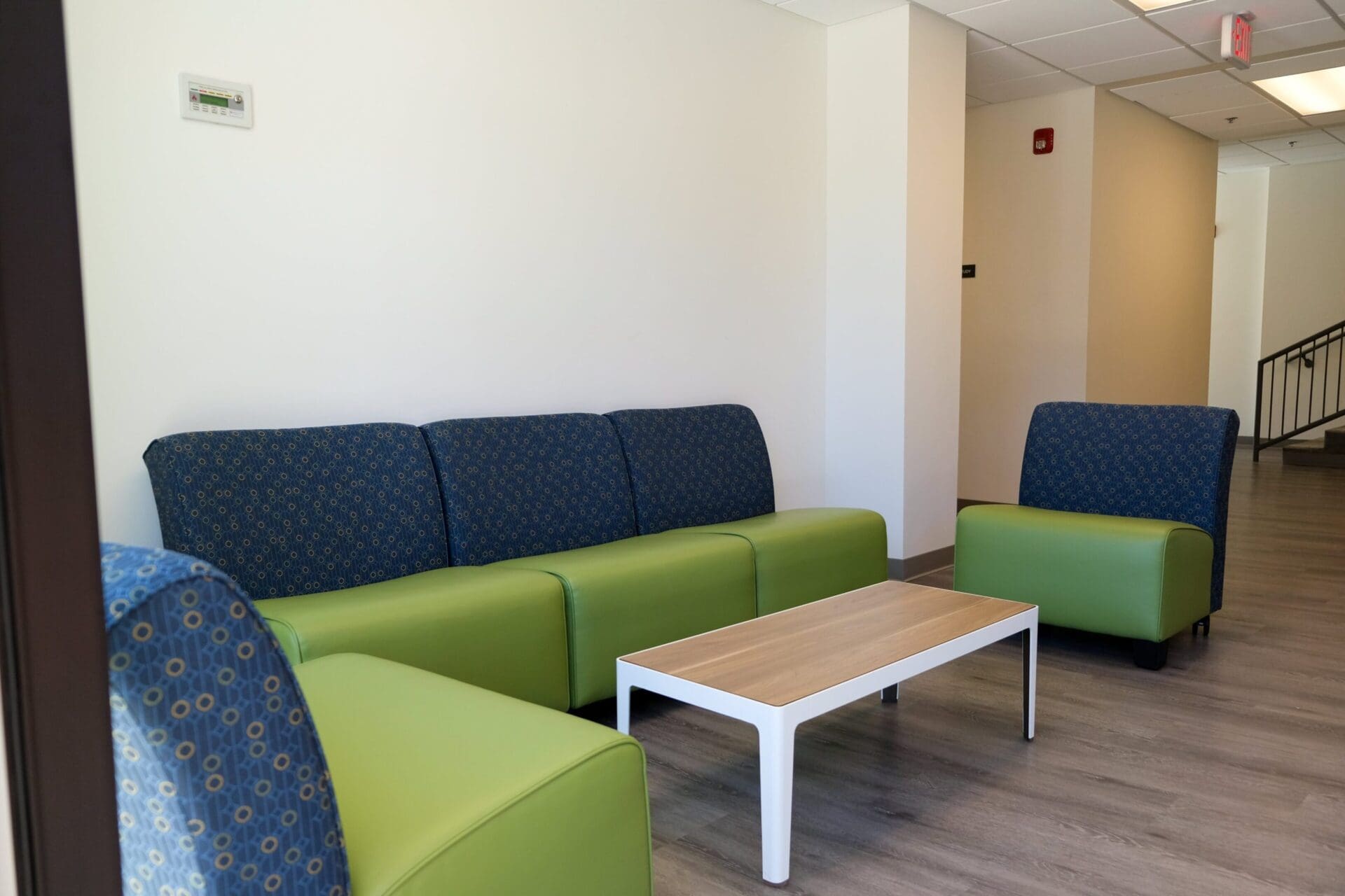 Modern waiting area with colorful seating.