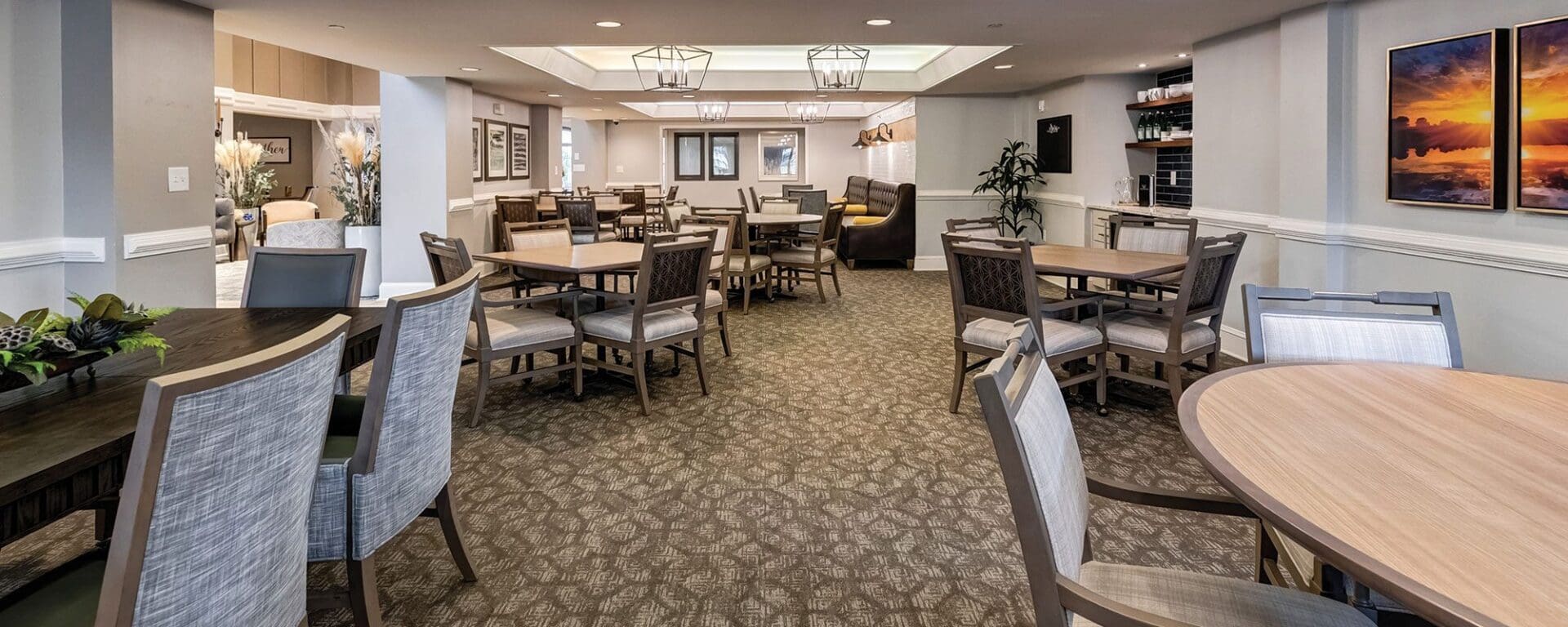 Bright upscale communal dining area with seating