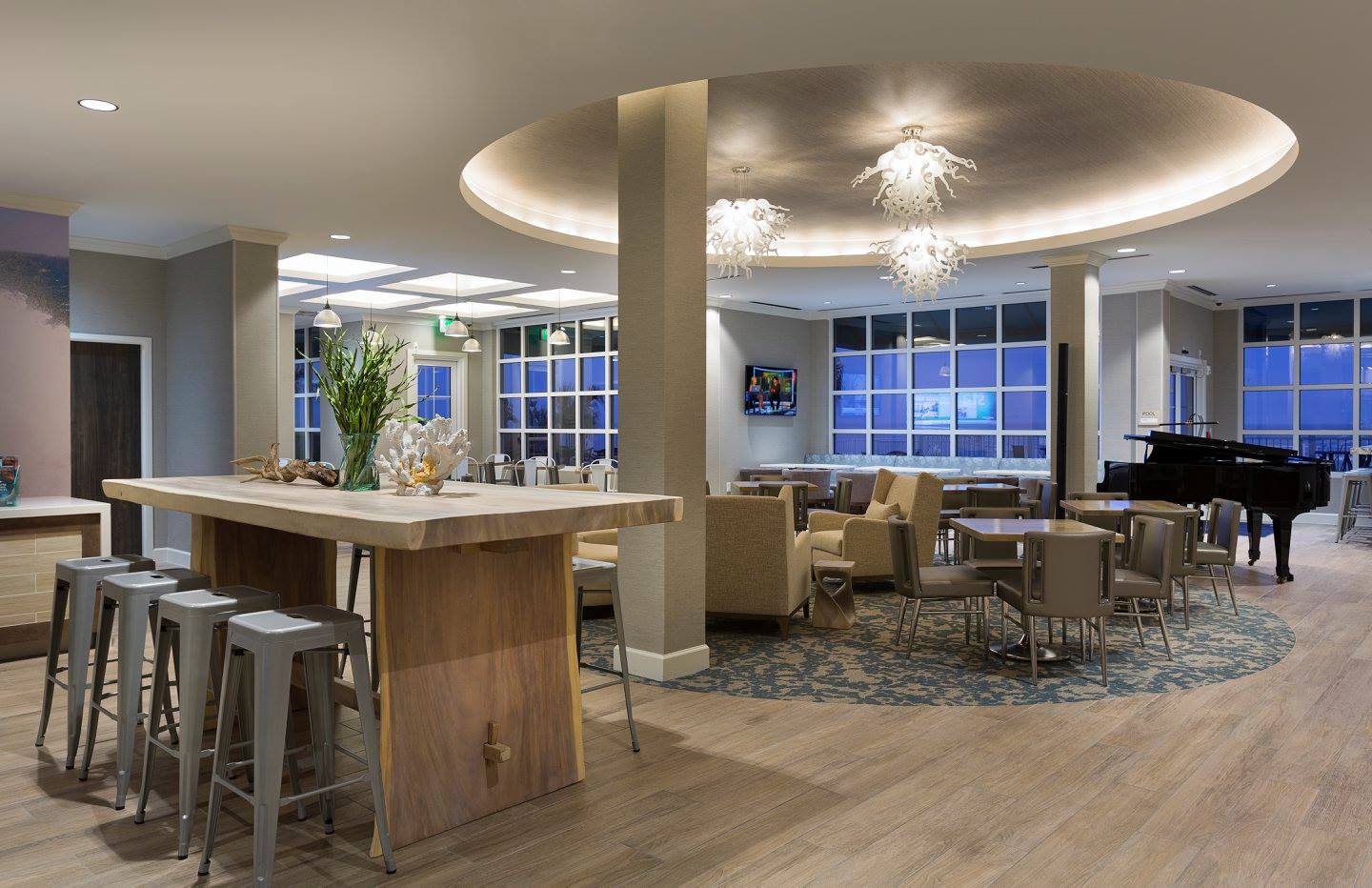 Modern hotel lounge with piano and seating