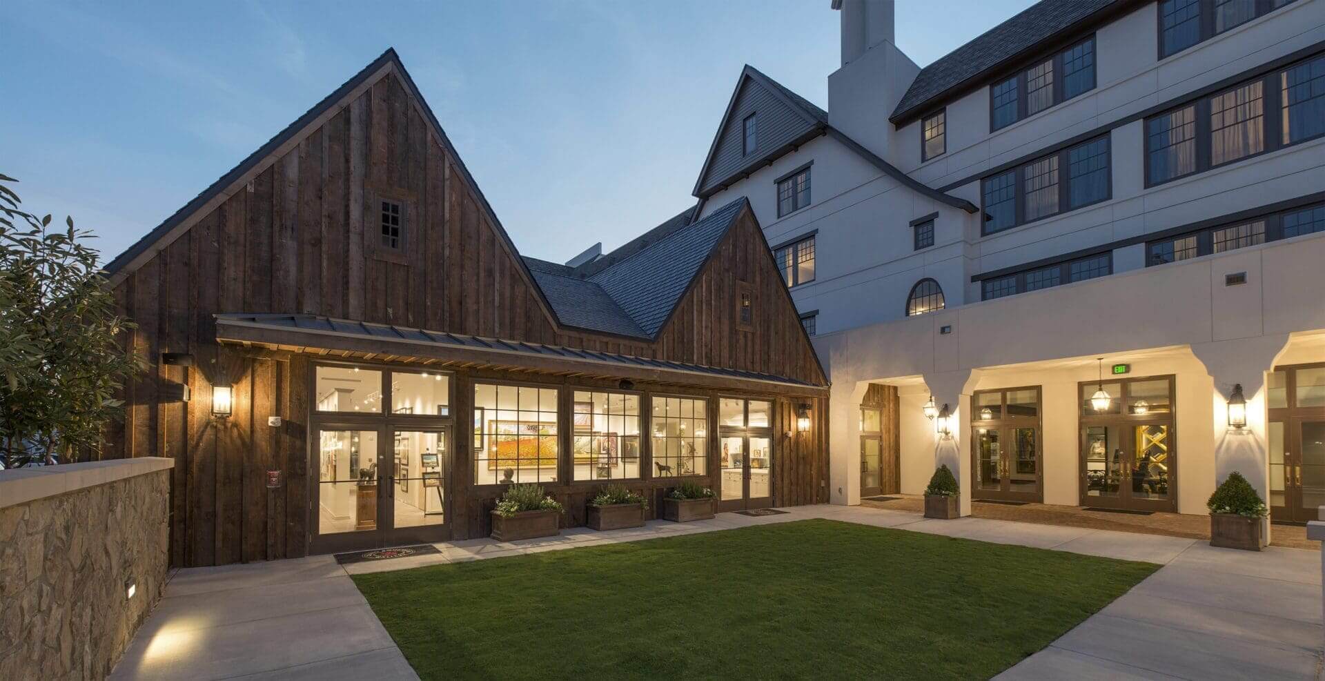 Modern building with wooden and stucco facade.