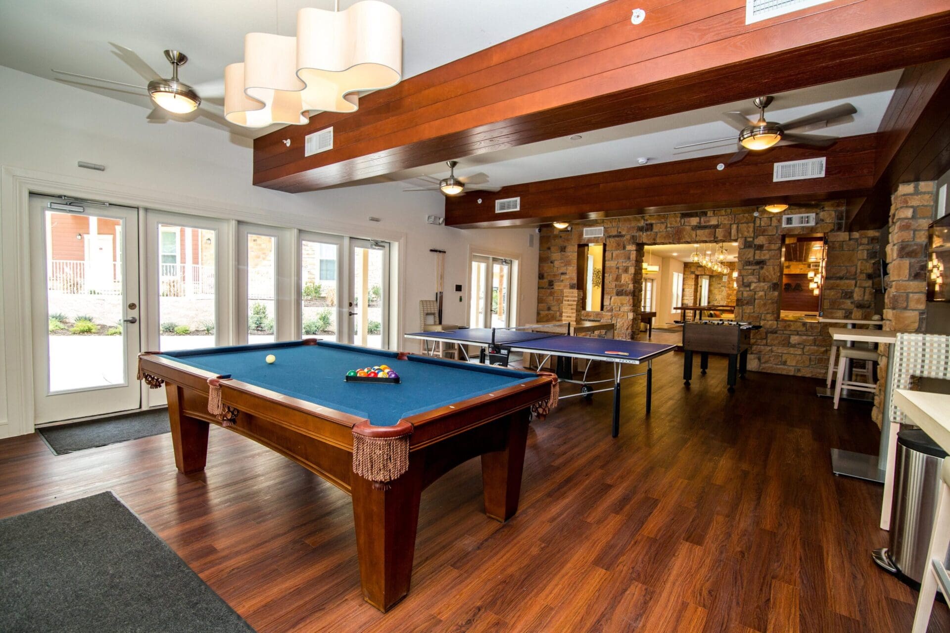 Game room with pool and ping pong tables.