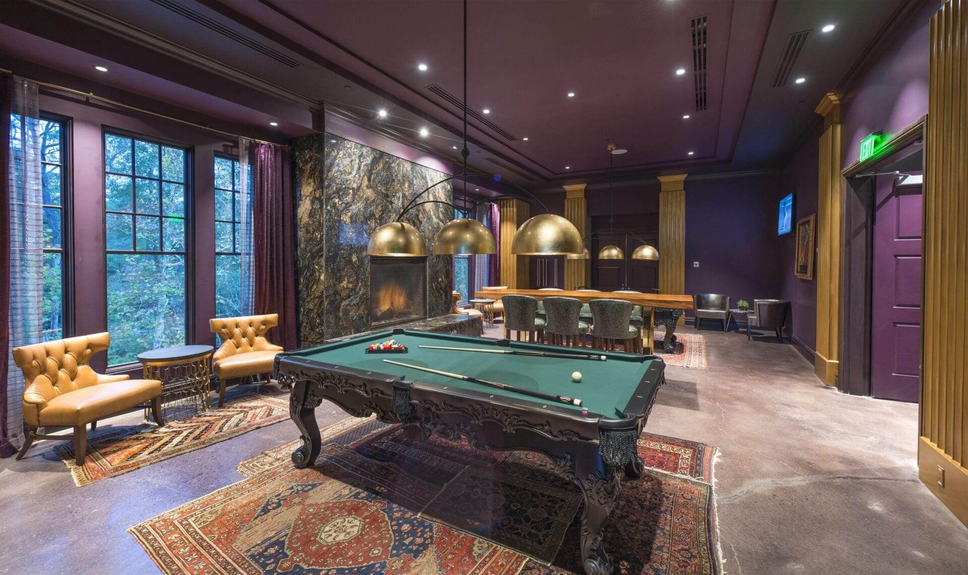 Luxurious room with pool table and seating.