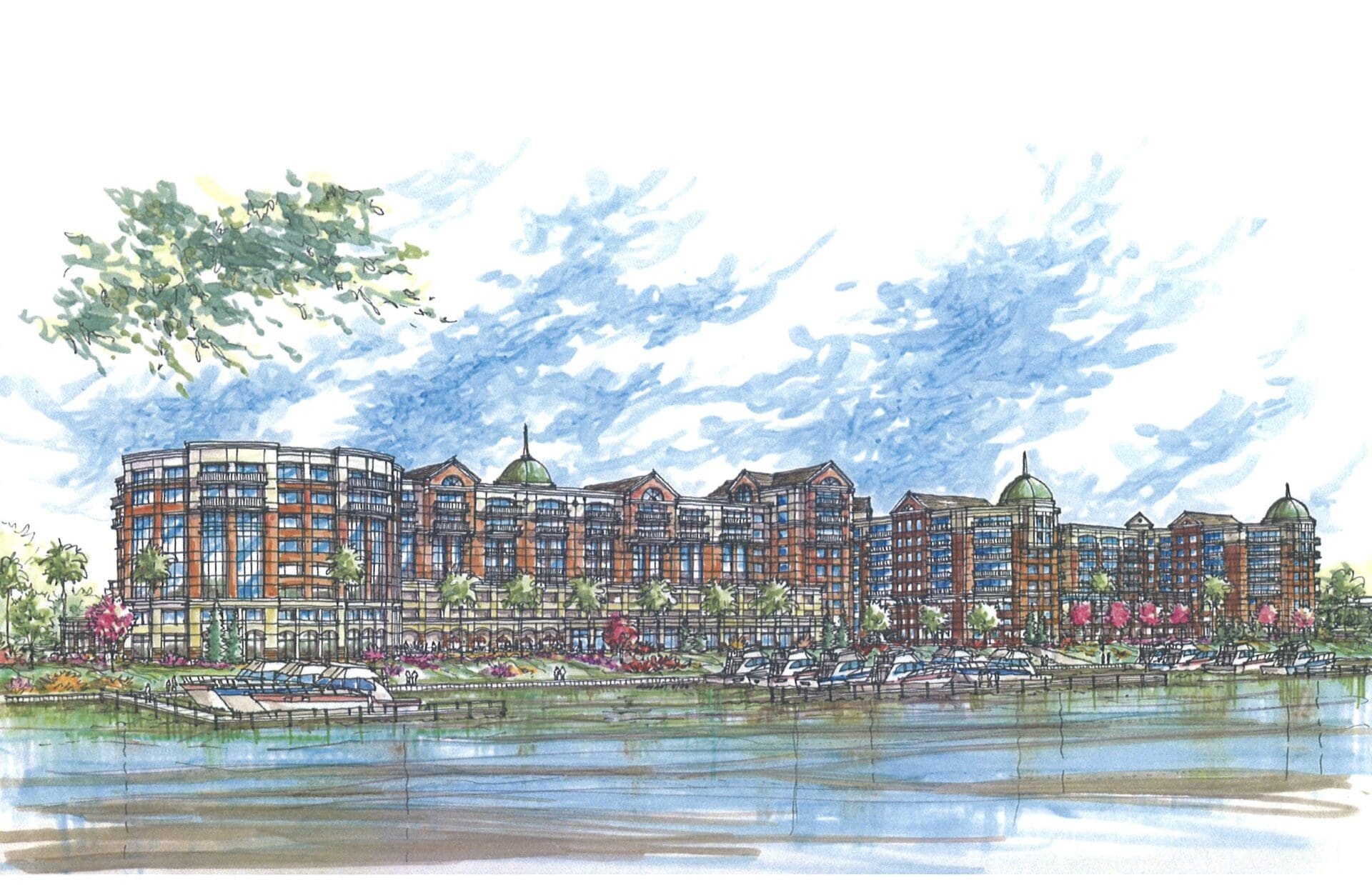 Waterfront resort complex with landscaped surroundings.