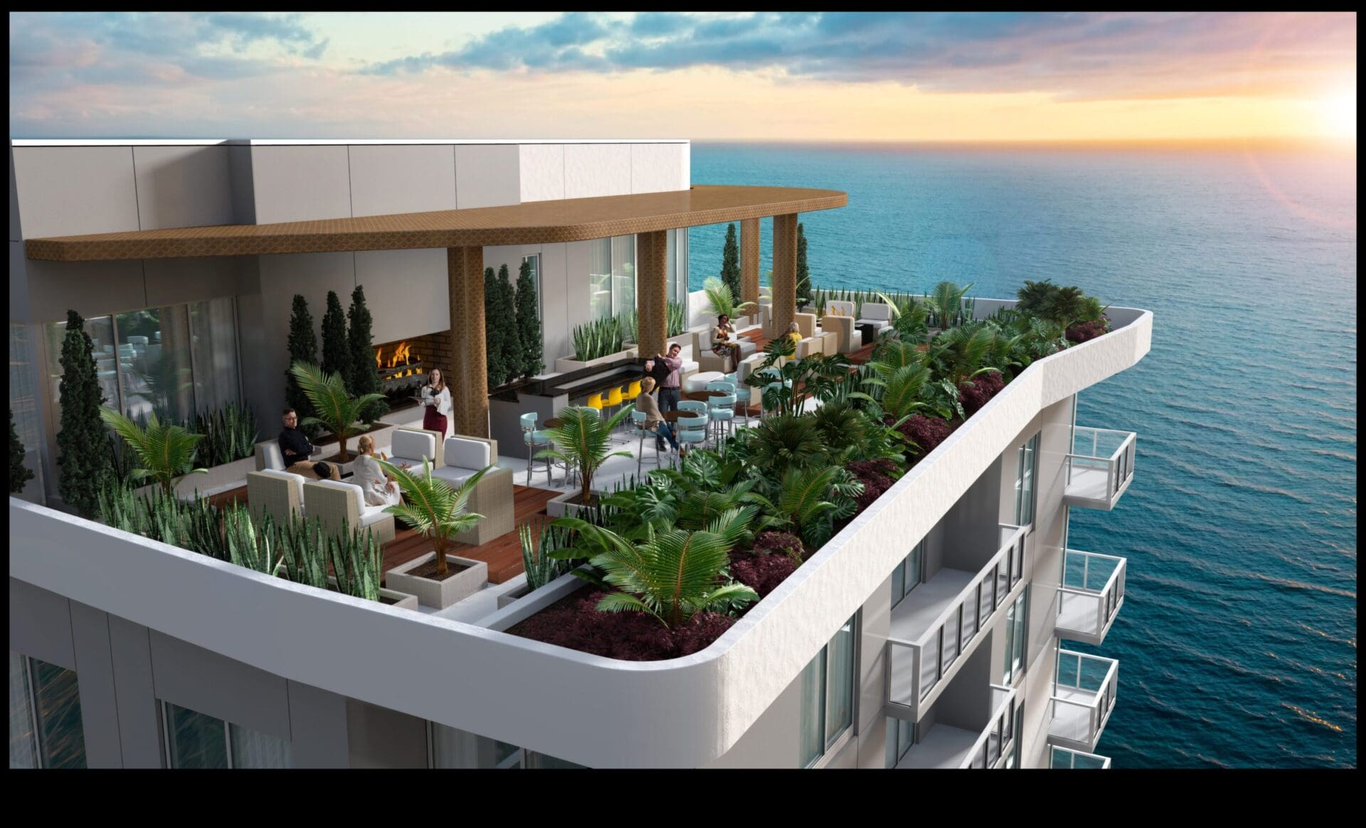 Rooftop terrace overlooking ocean at sunset.