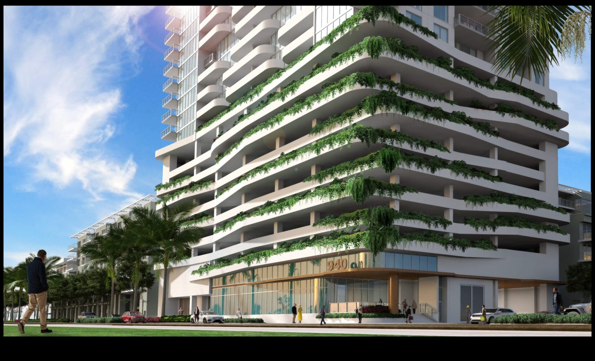 Modern building with greenery and palm trees.