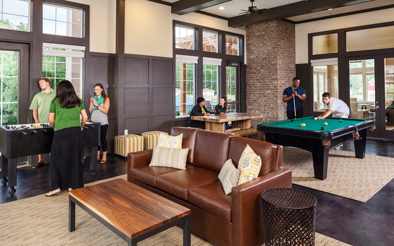 People socializing in a game room.