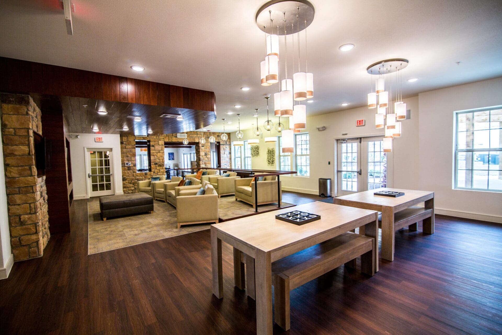 Modern lounge area with tables and sofas.