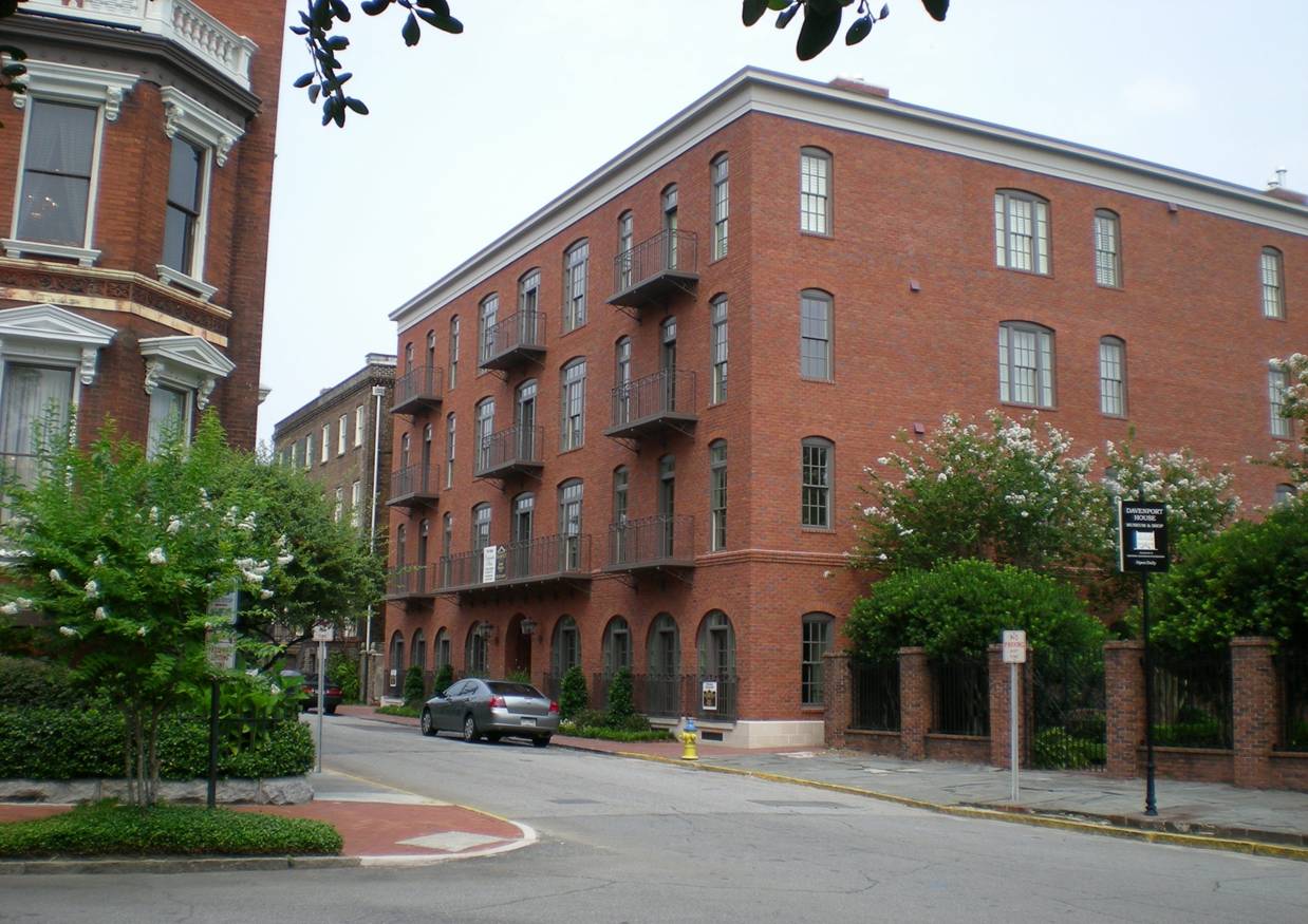 Red brick building on a street corner.