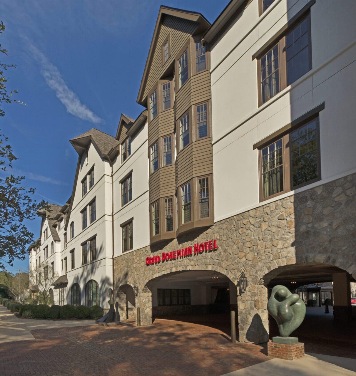 Hotel exterior with stone and brick facade.
