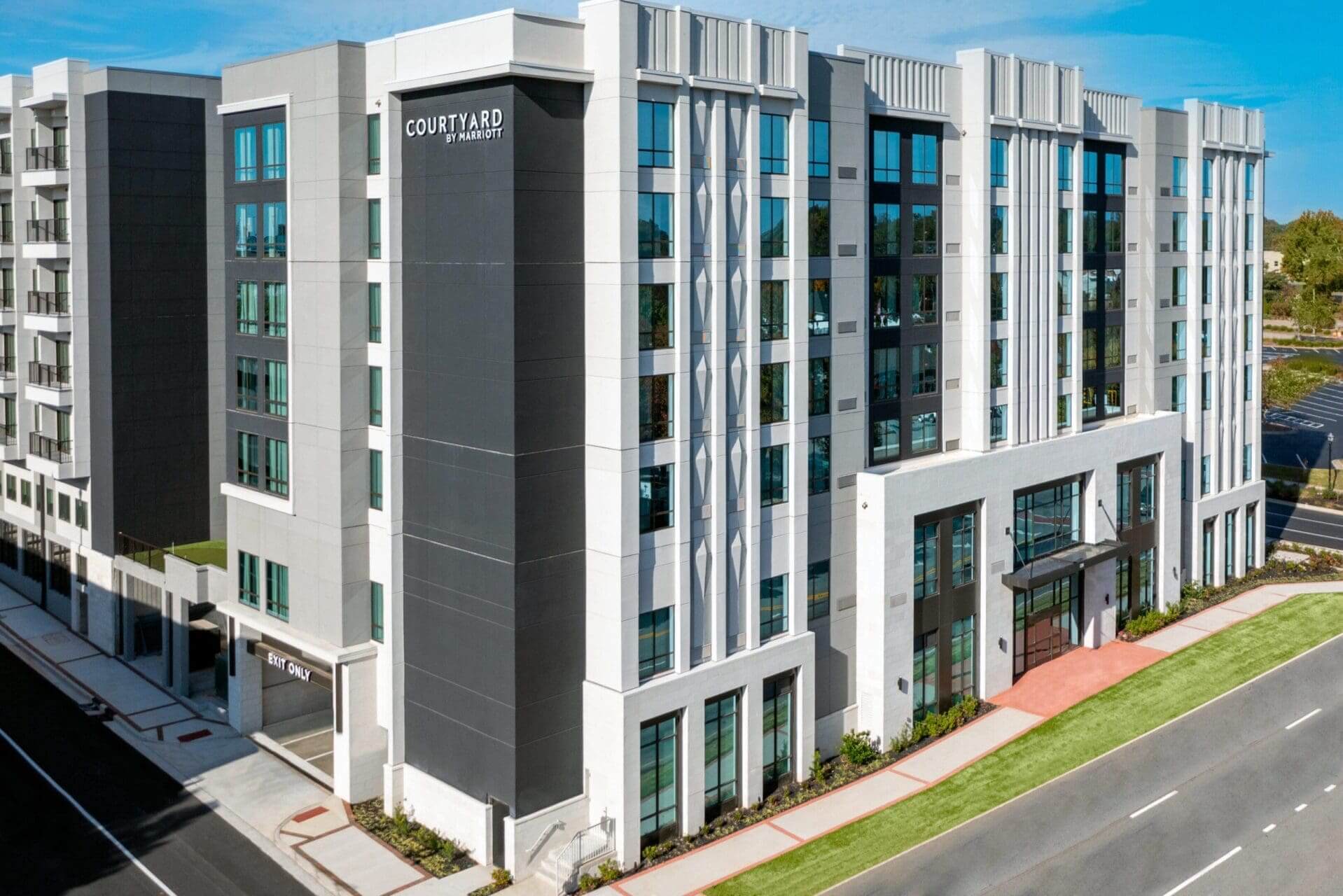 Modern hotel building with glass windows.