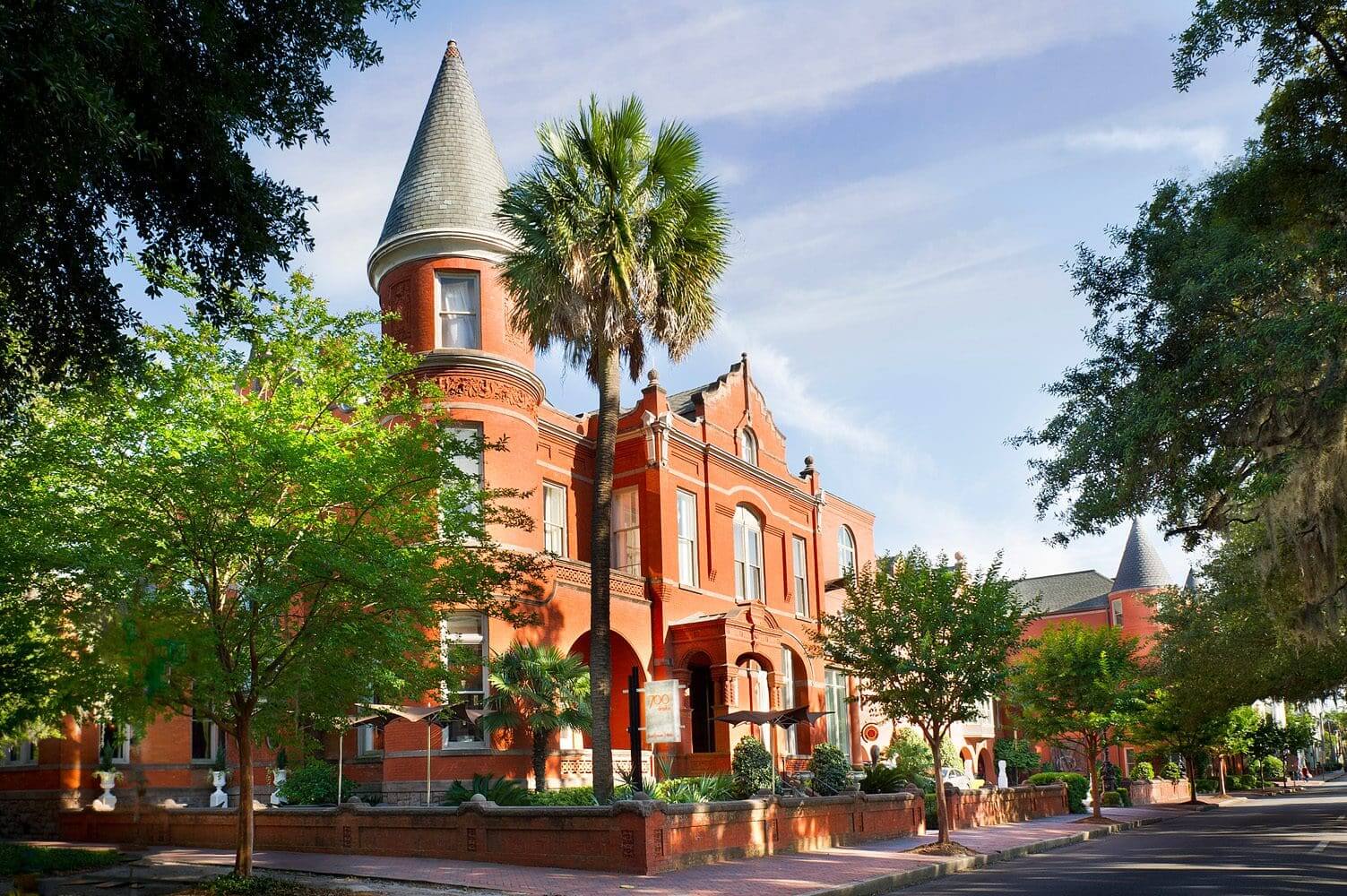 Historic red brick building with turret.