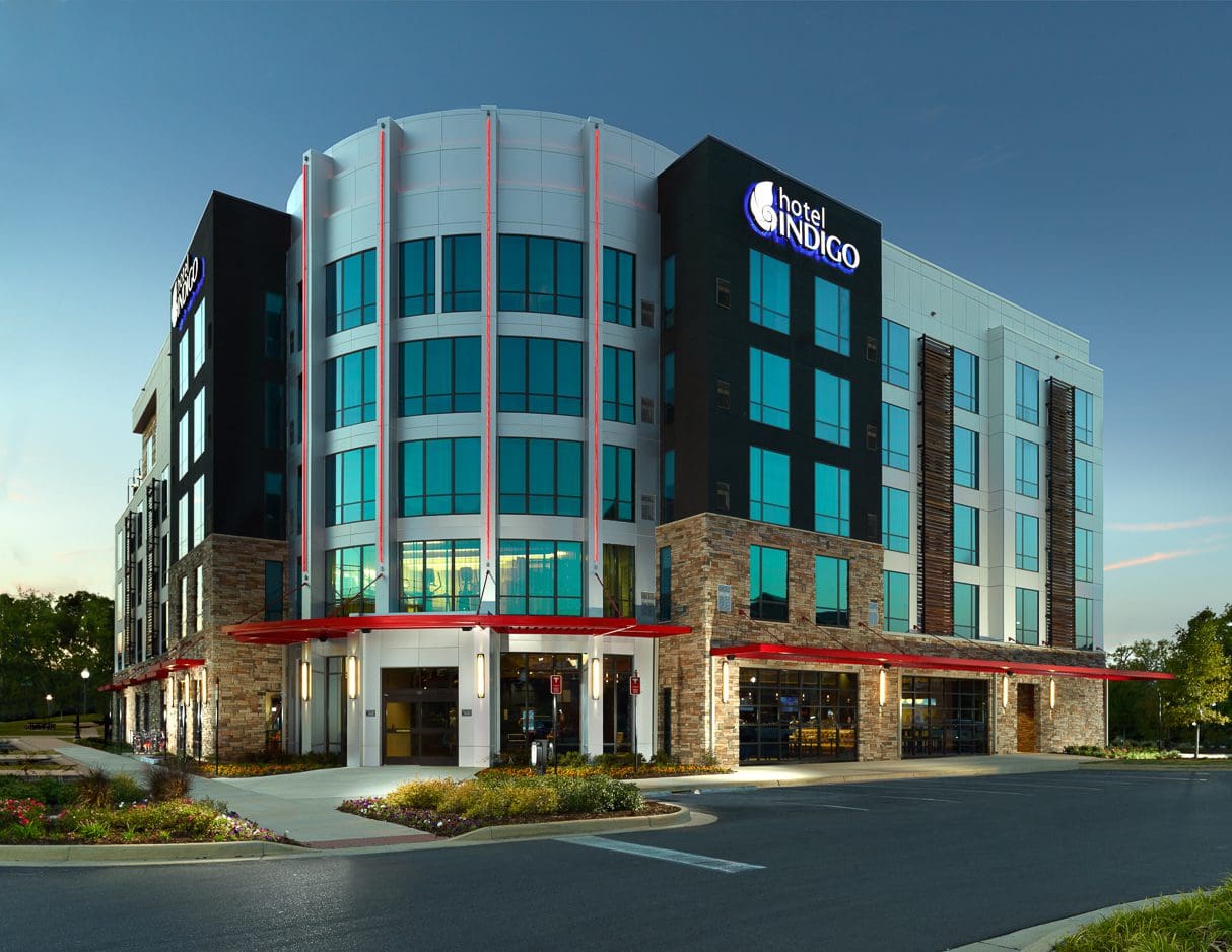 Modern hotel building with glass facade.