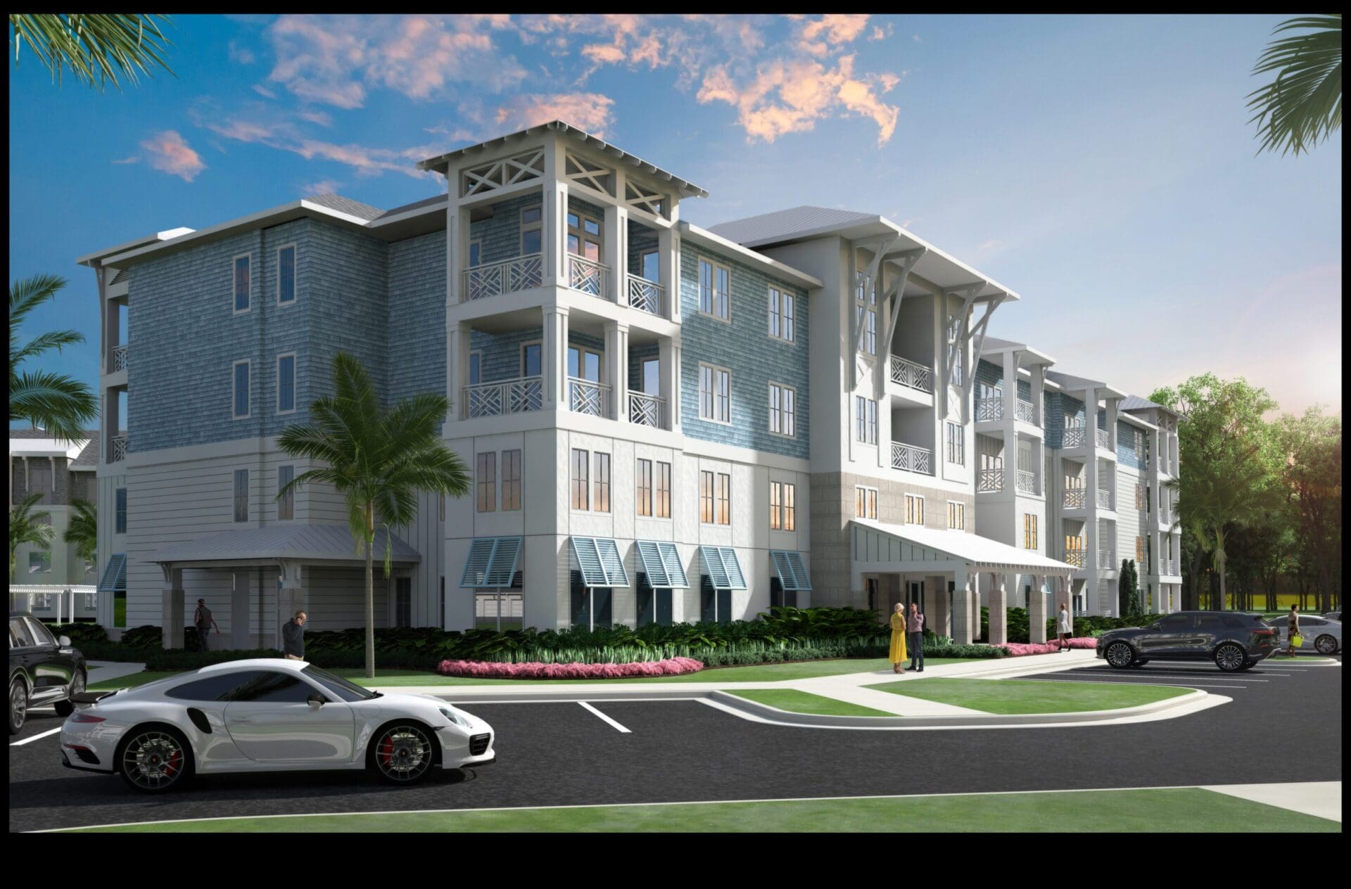 Modern apartment building with parked cars outside.