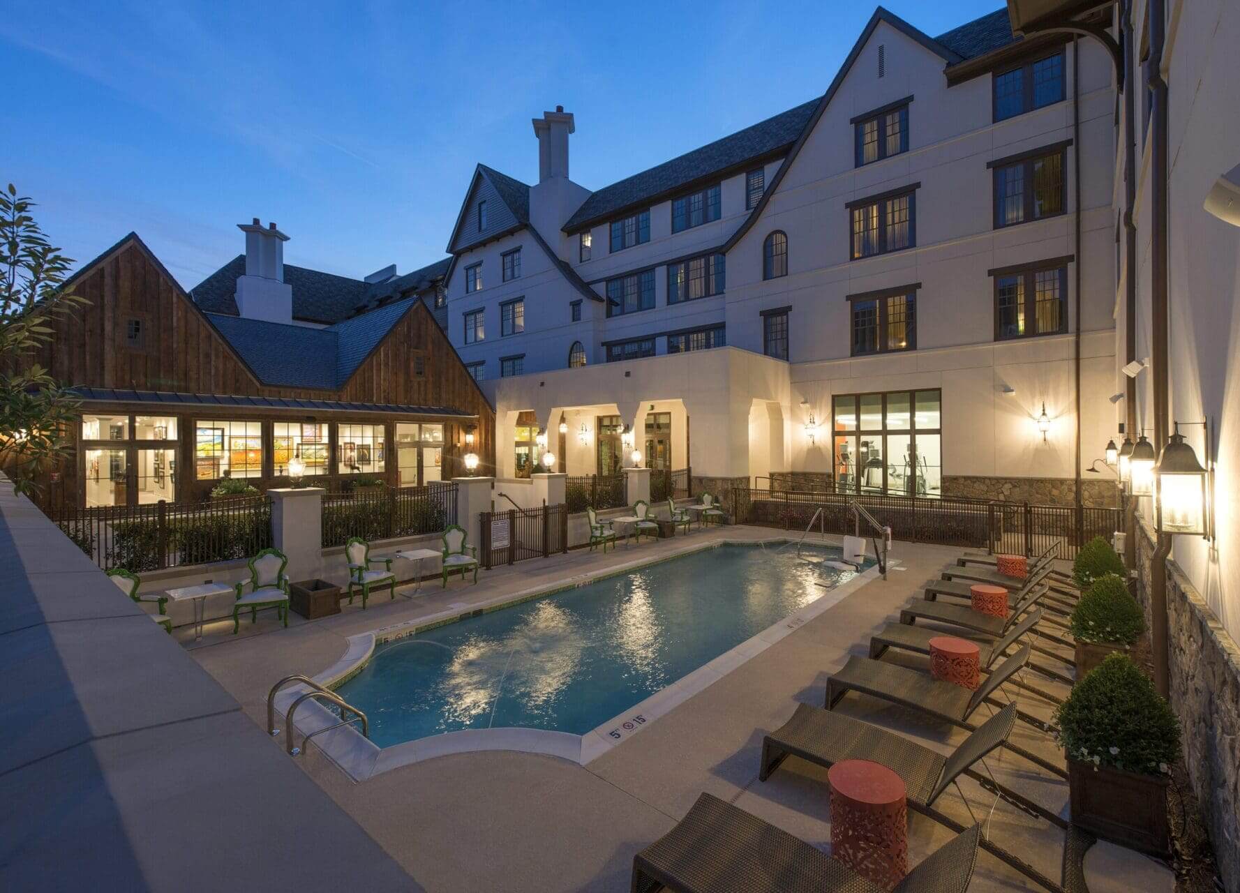 Outdoor pool at hotel during evening twilight.