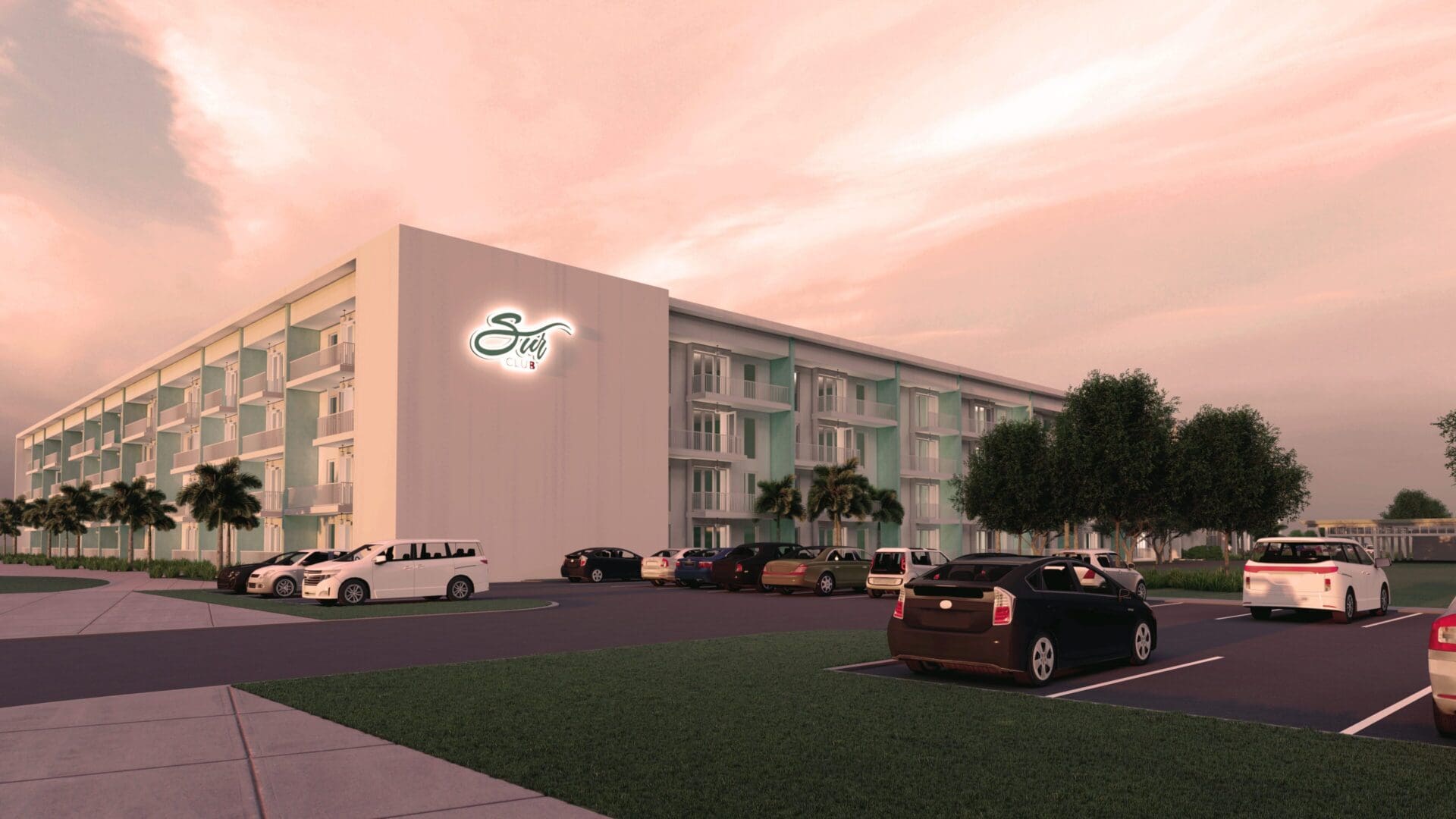 Sunset view of surf hotel and parking