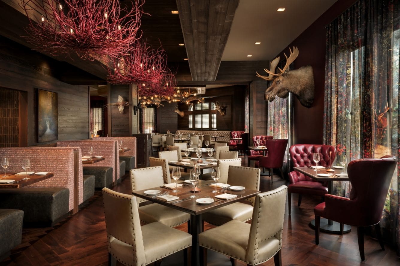 Elegant restaurant with moose head decor.
