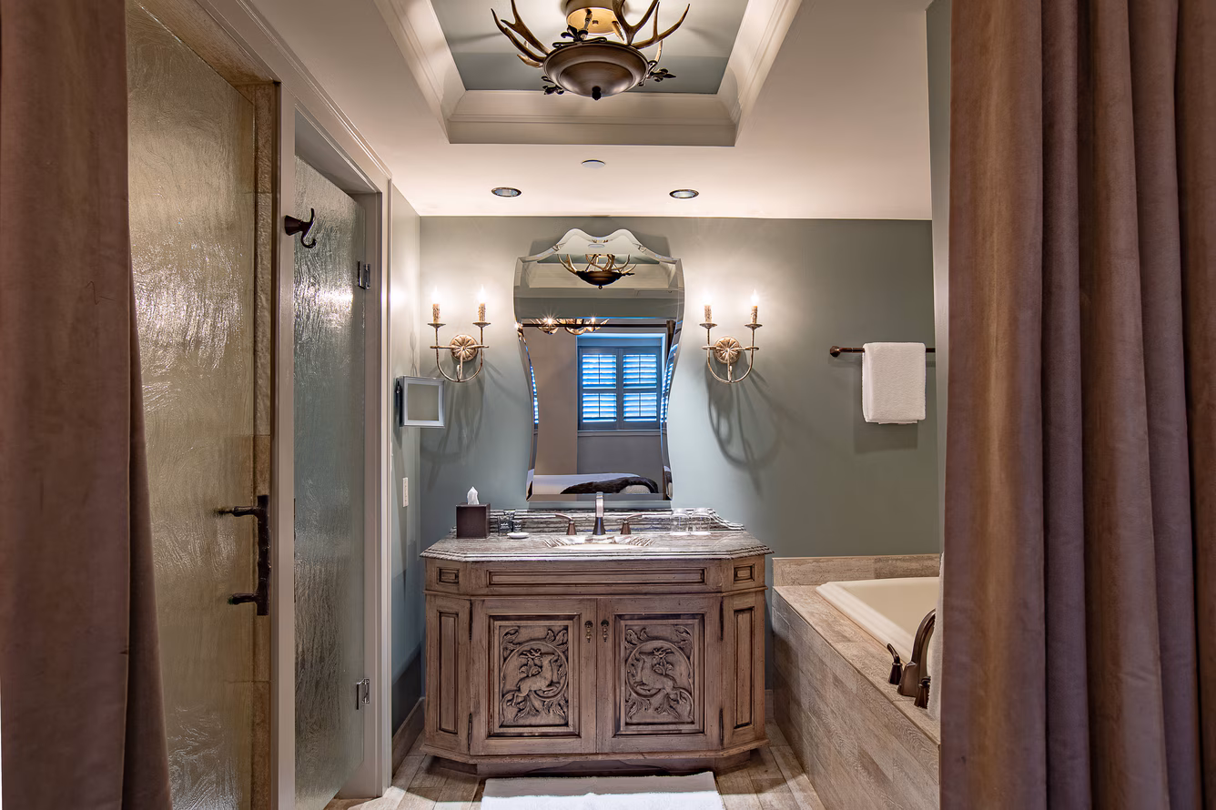 Elegant bathroom with vanity and bathtub.
