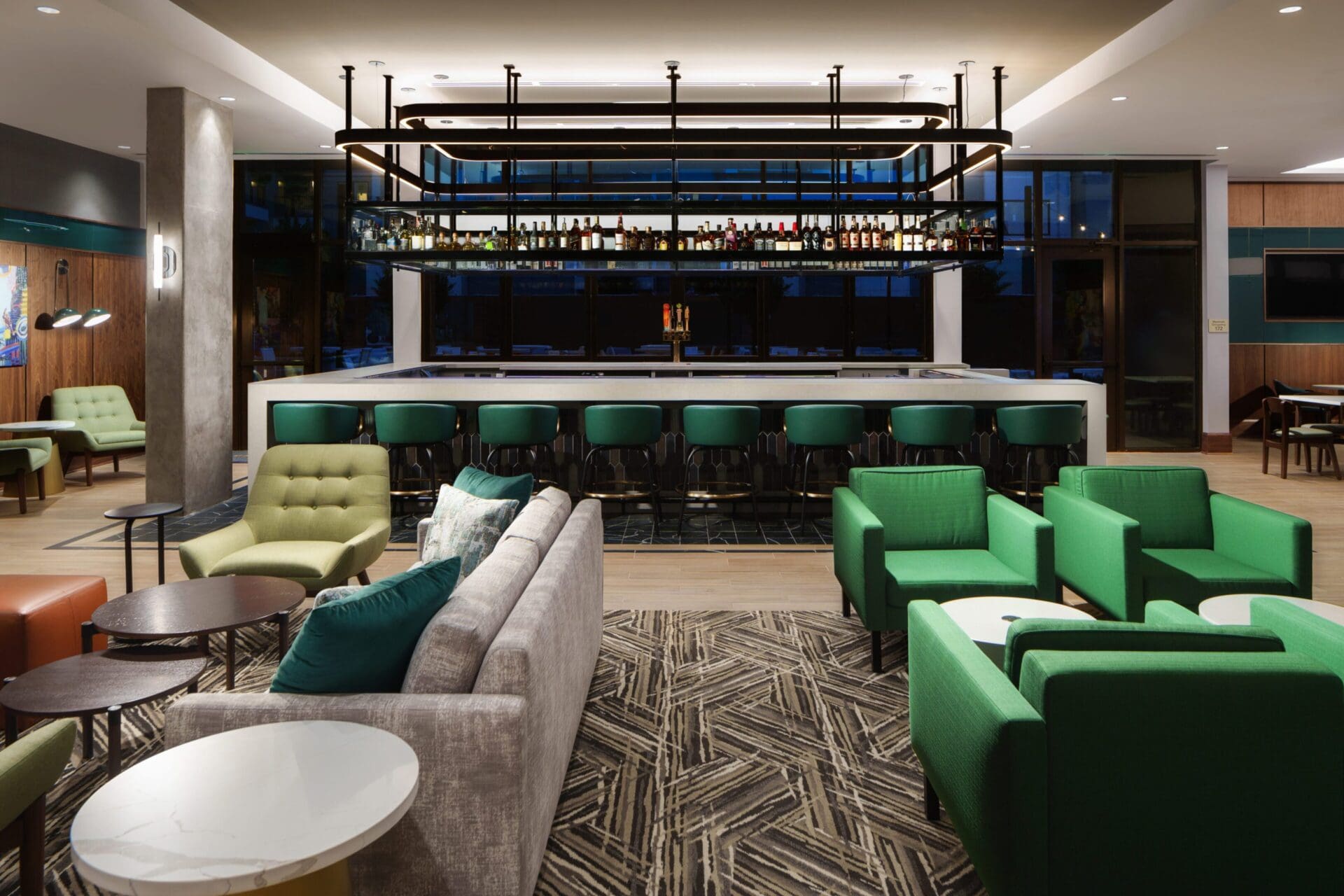 Modern hotel lounge with green chairs