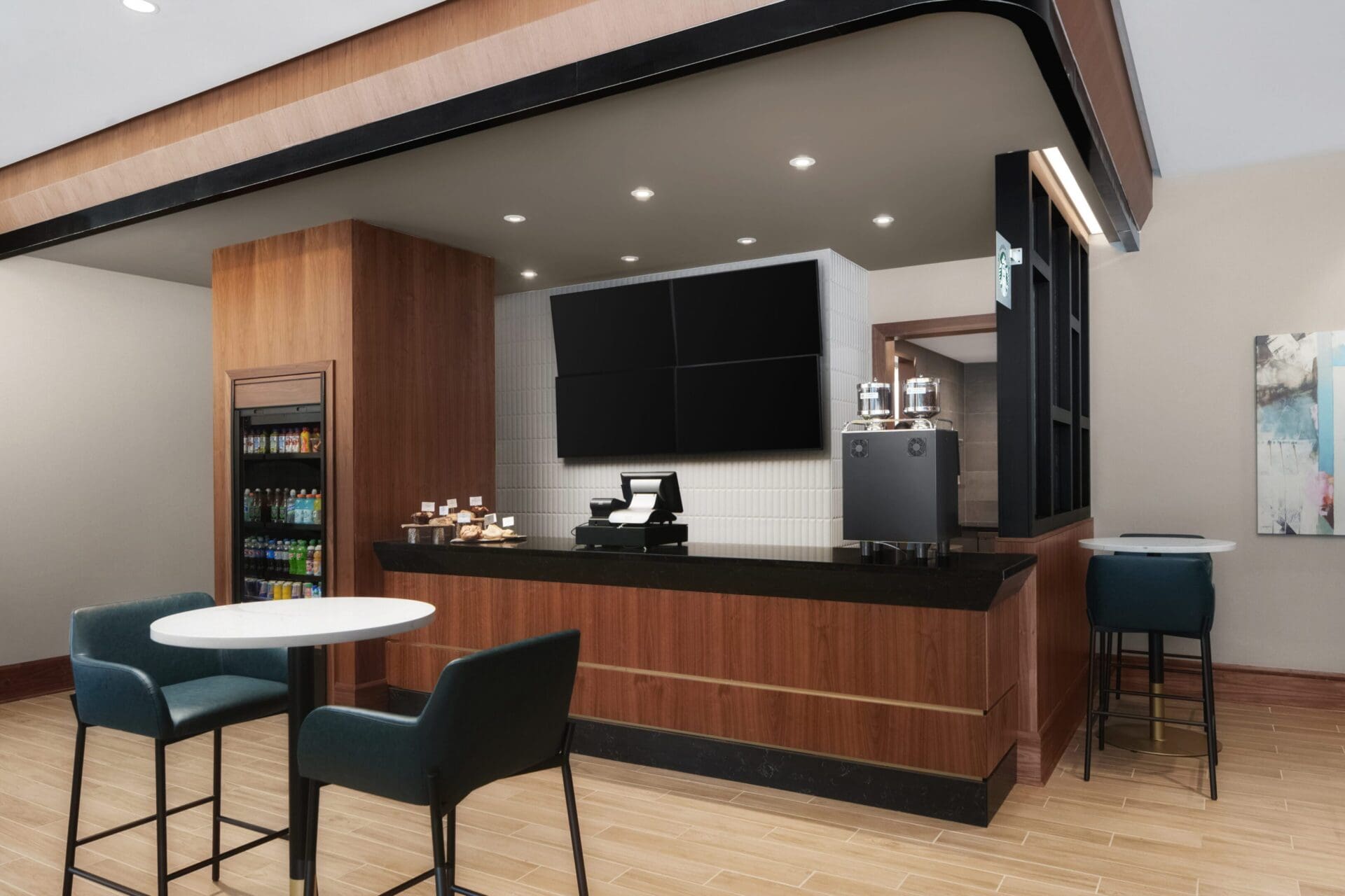 Modern cafe interior with seating and counter.