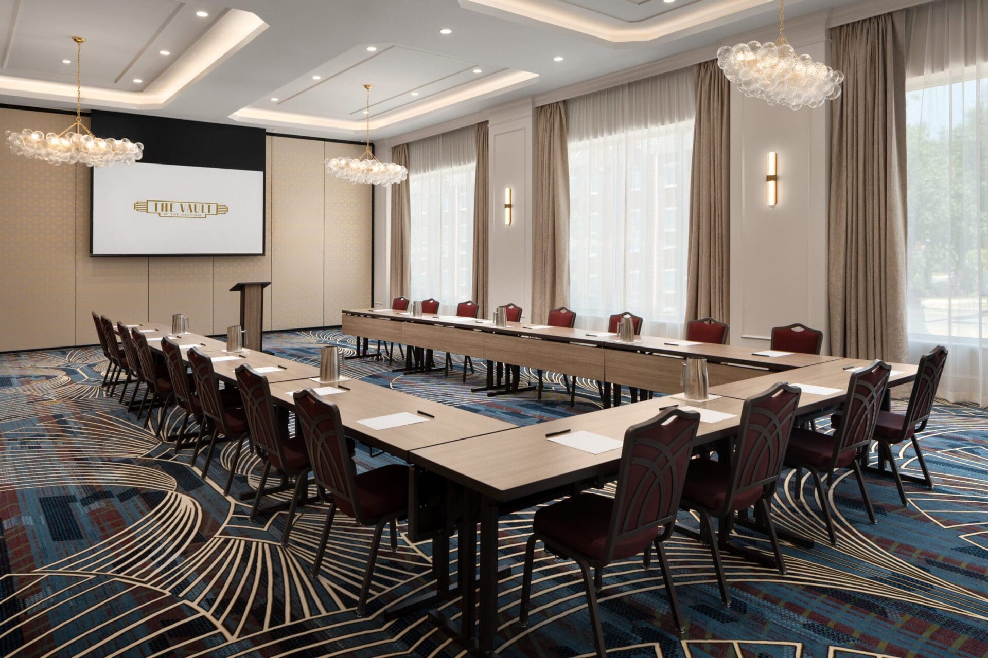 Modern conference room with U-shaped table setup.