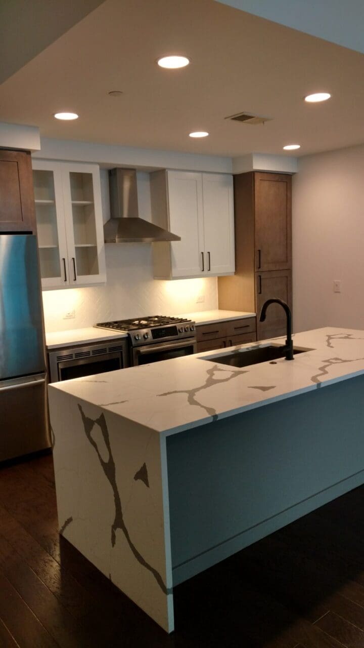 Modern kitchen with marble-look waterfall island