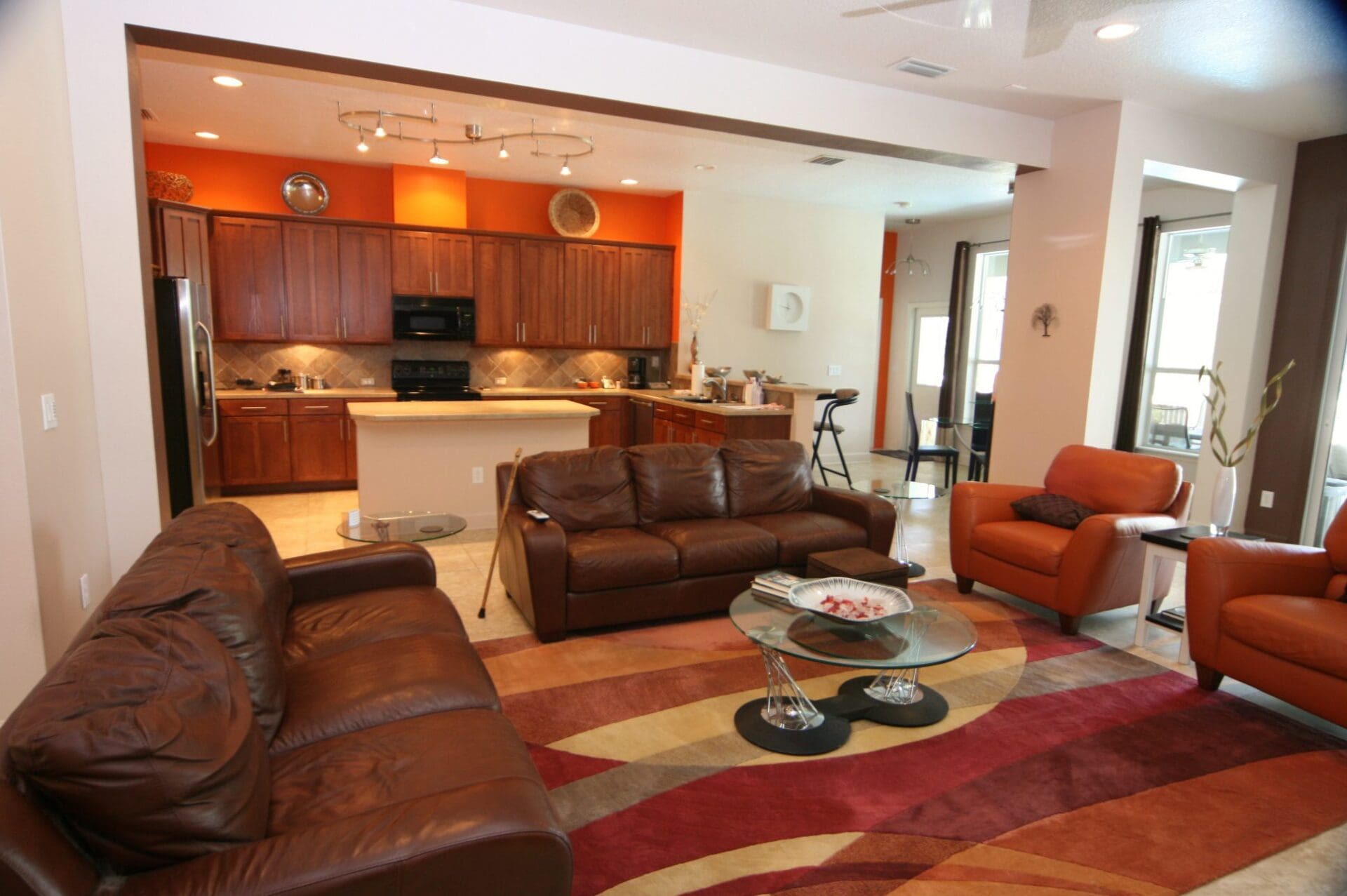 Modern living room with open kitchen design.
