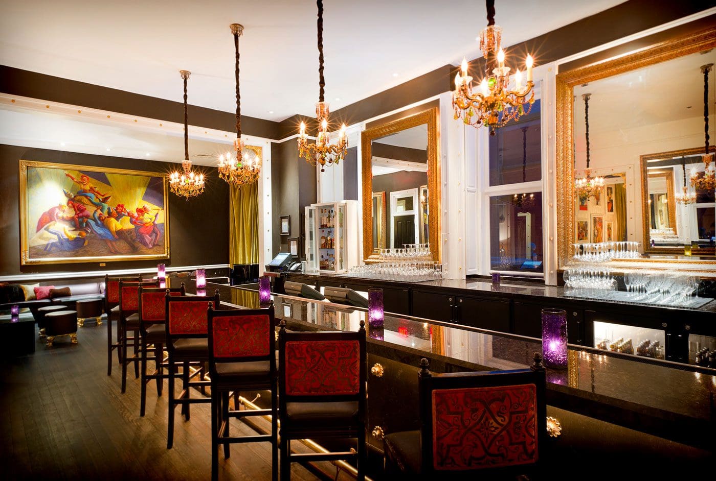 Upscale lounge bar with chandeliers and mirrors