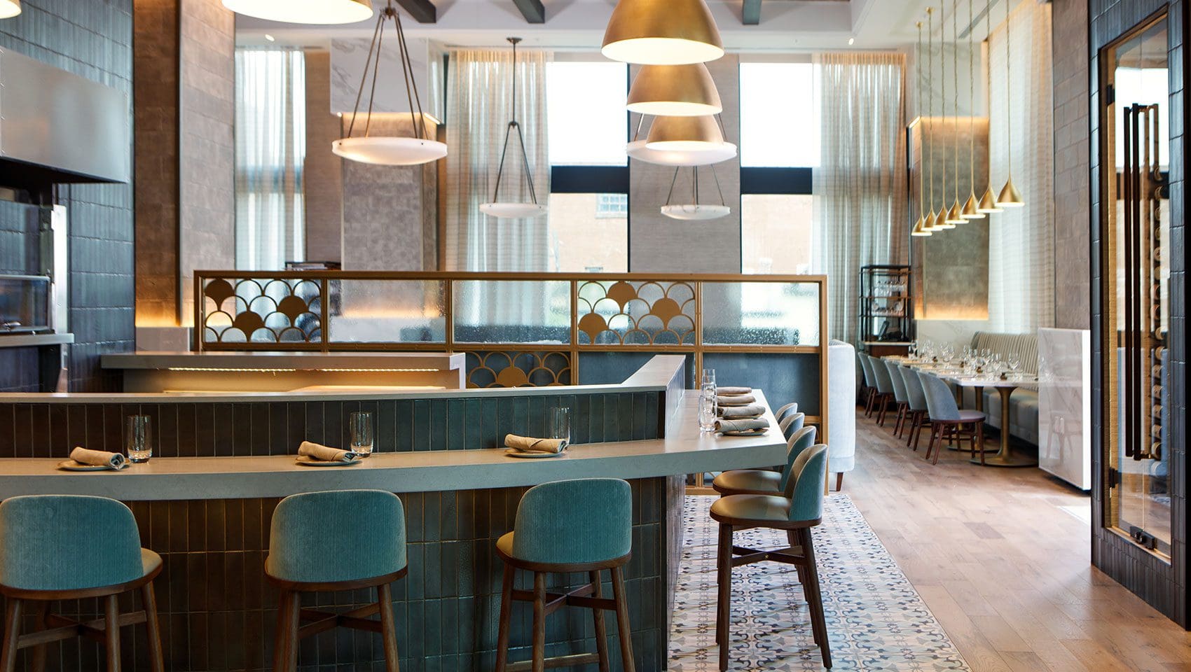 Modern restaurant interior with elegant lighting fixtures.