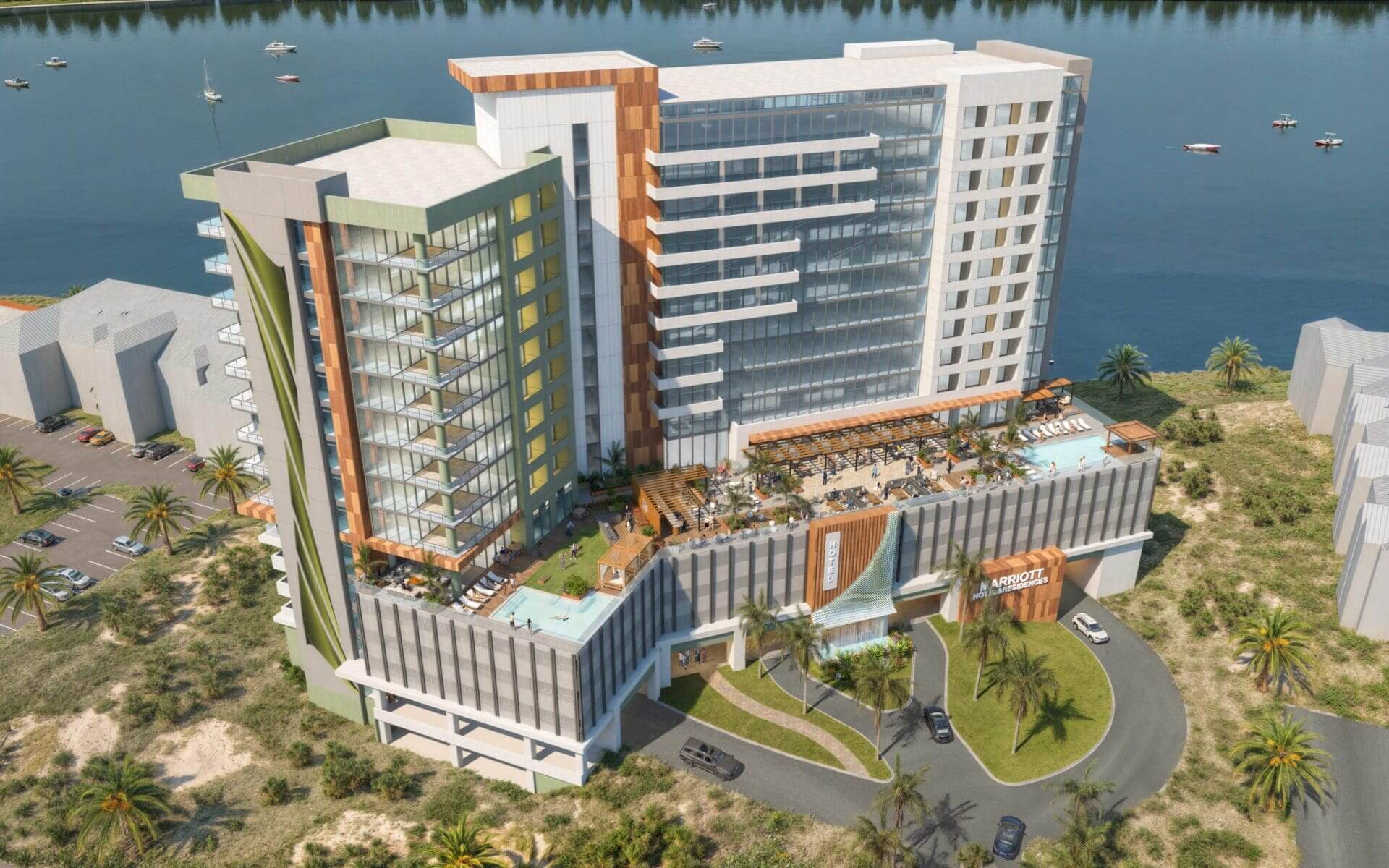 Modern riverside hotel with outdoor pool and terrace.