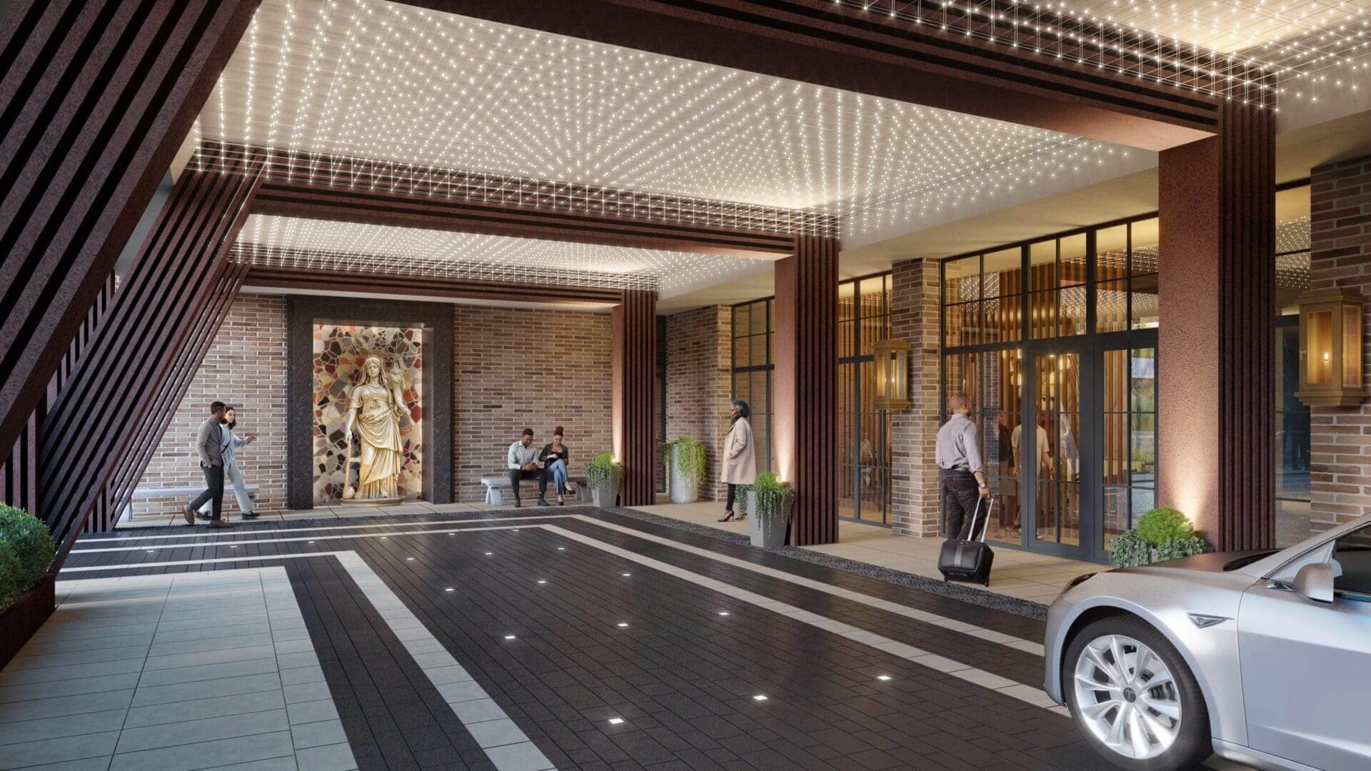 Elegant hotel entrance with people and lights.