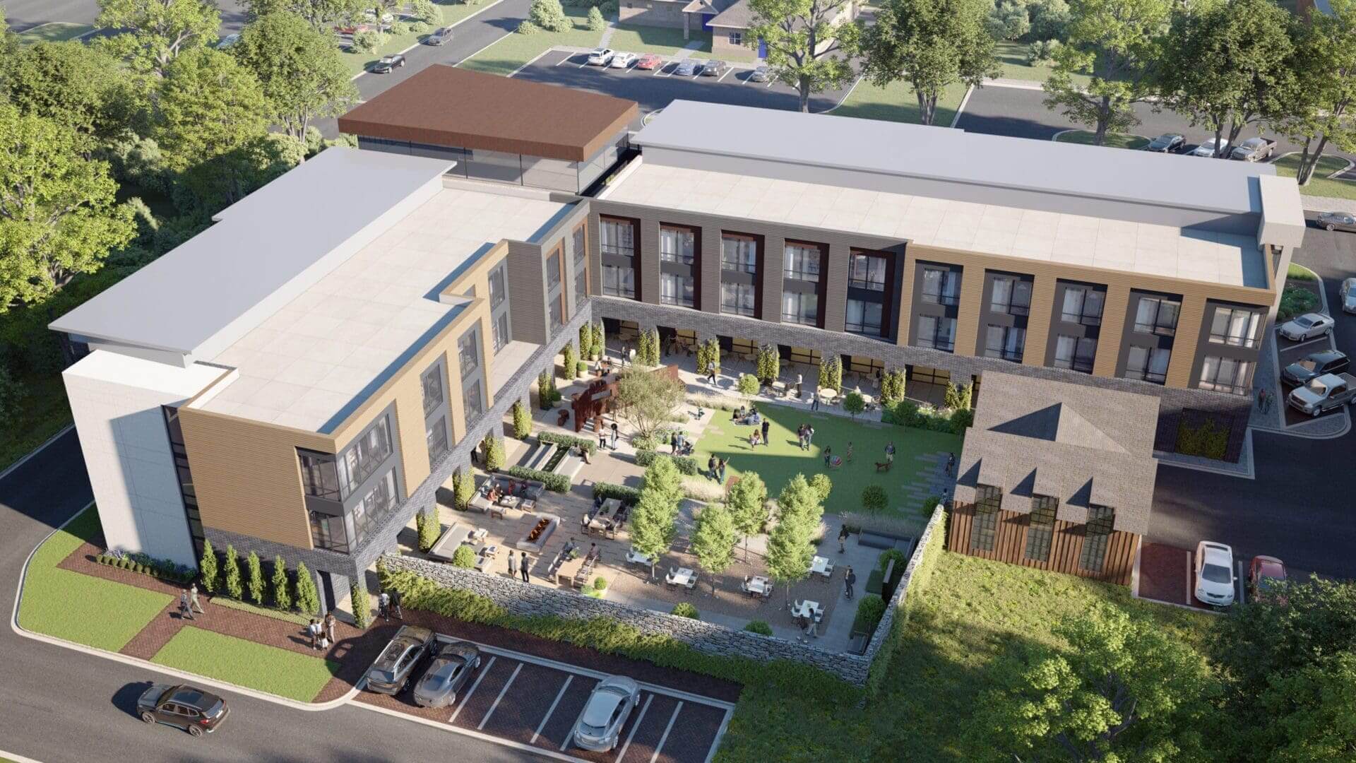 Modern building with central courtyard and greenery.